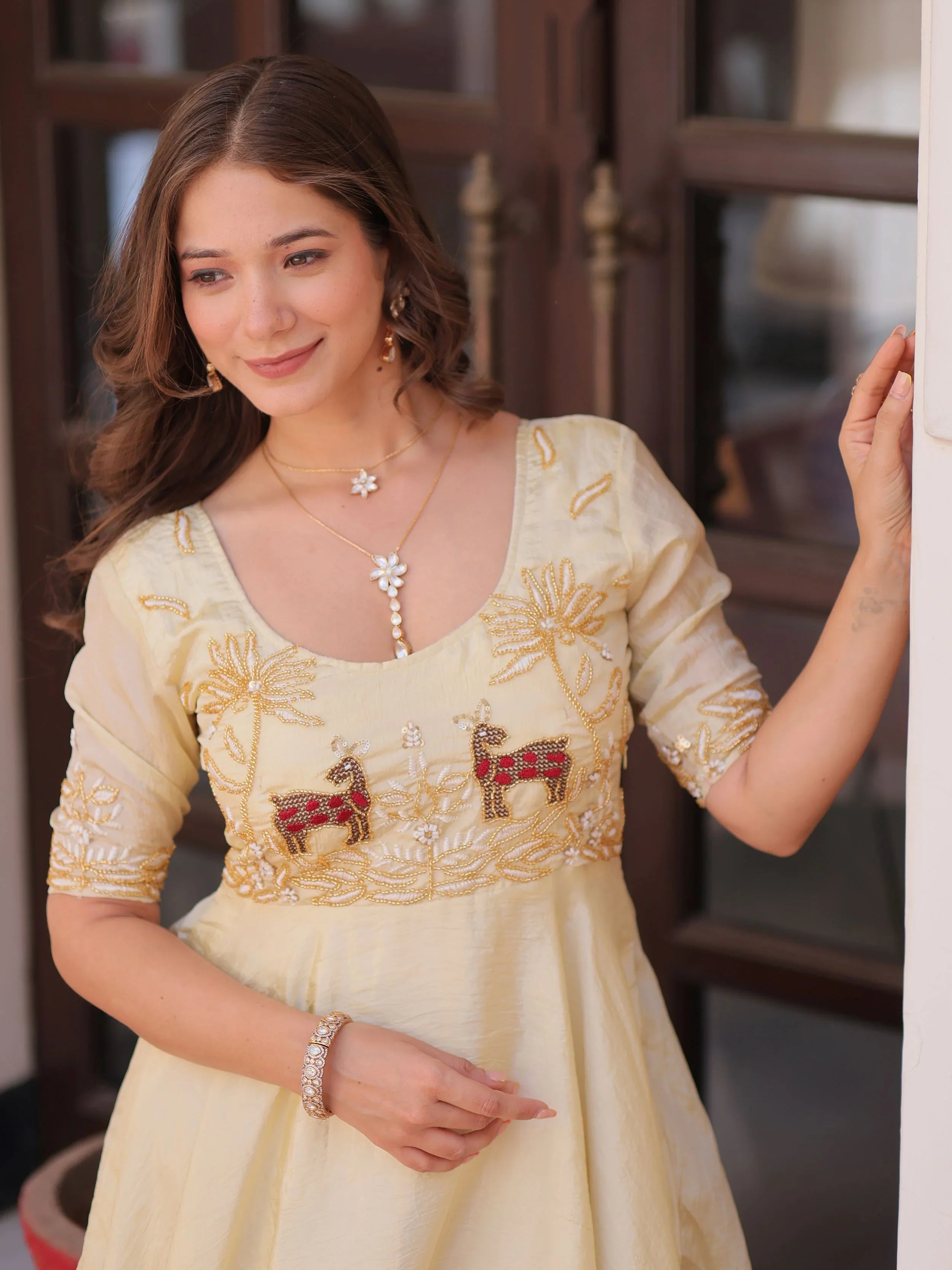 Light yellow gold crush umbrella flair gown with beads embroidery