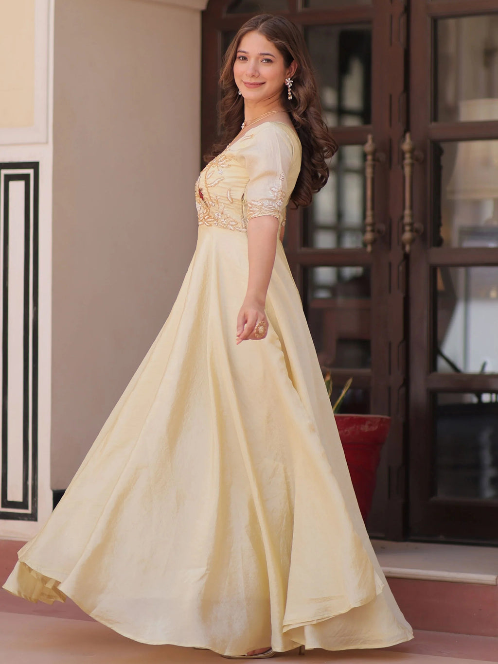 Light yellow gold crush umbrella flair gown with beads embroidery