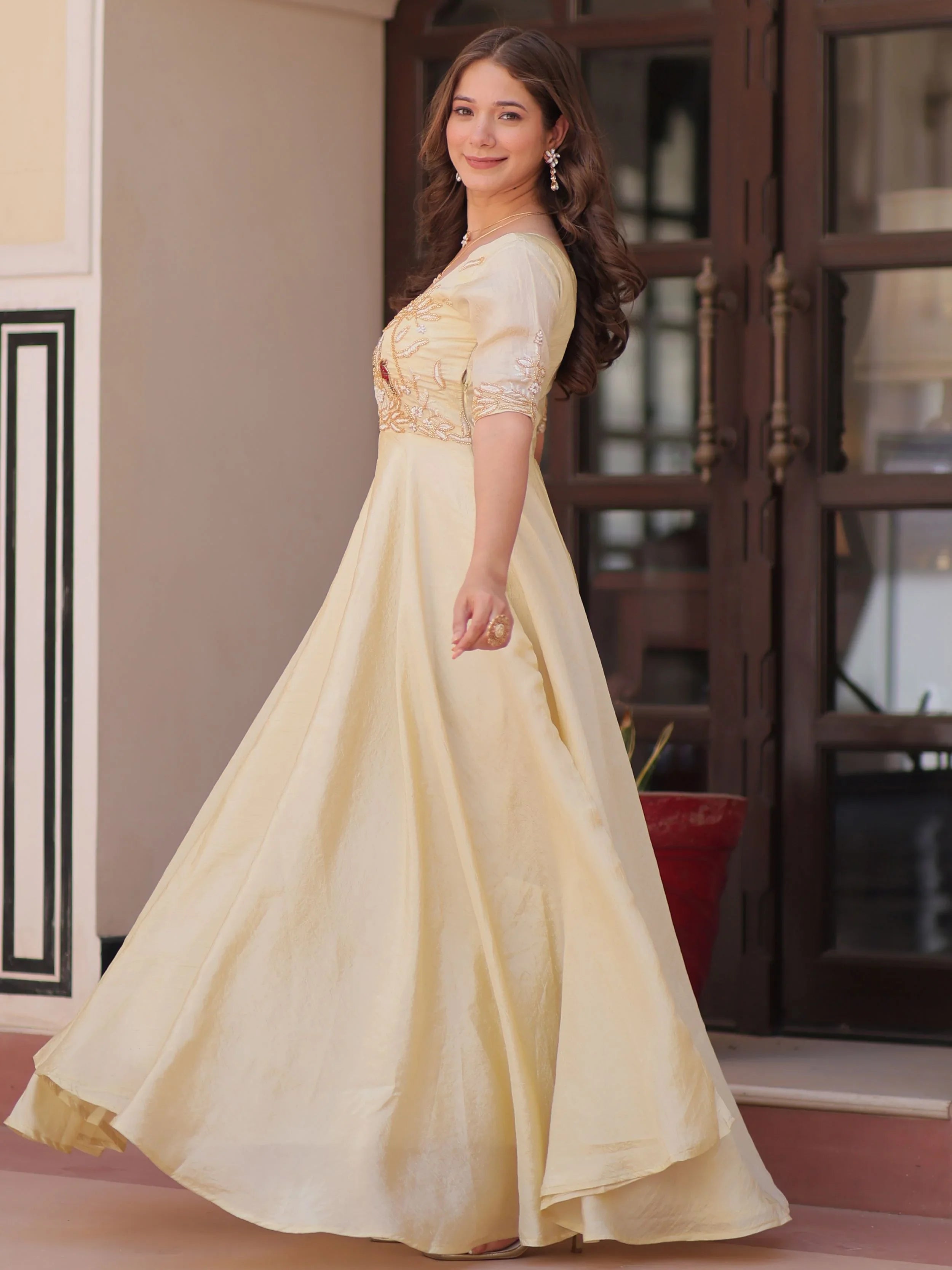 Light yellow gold crush umbrella flair gown with beads embroidery
