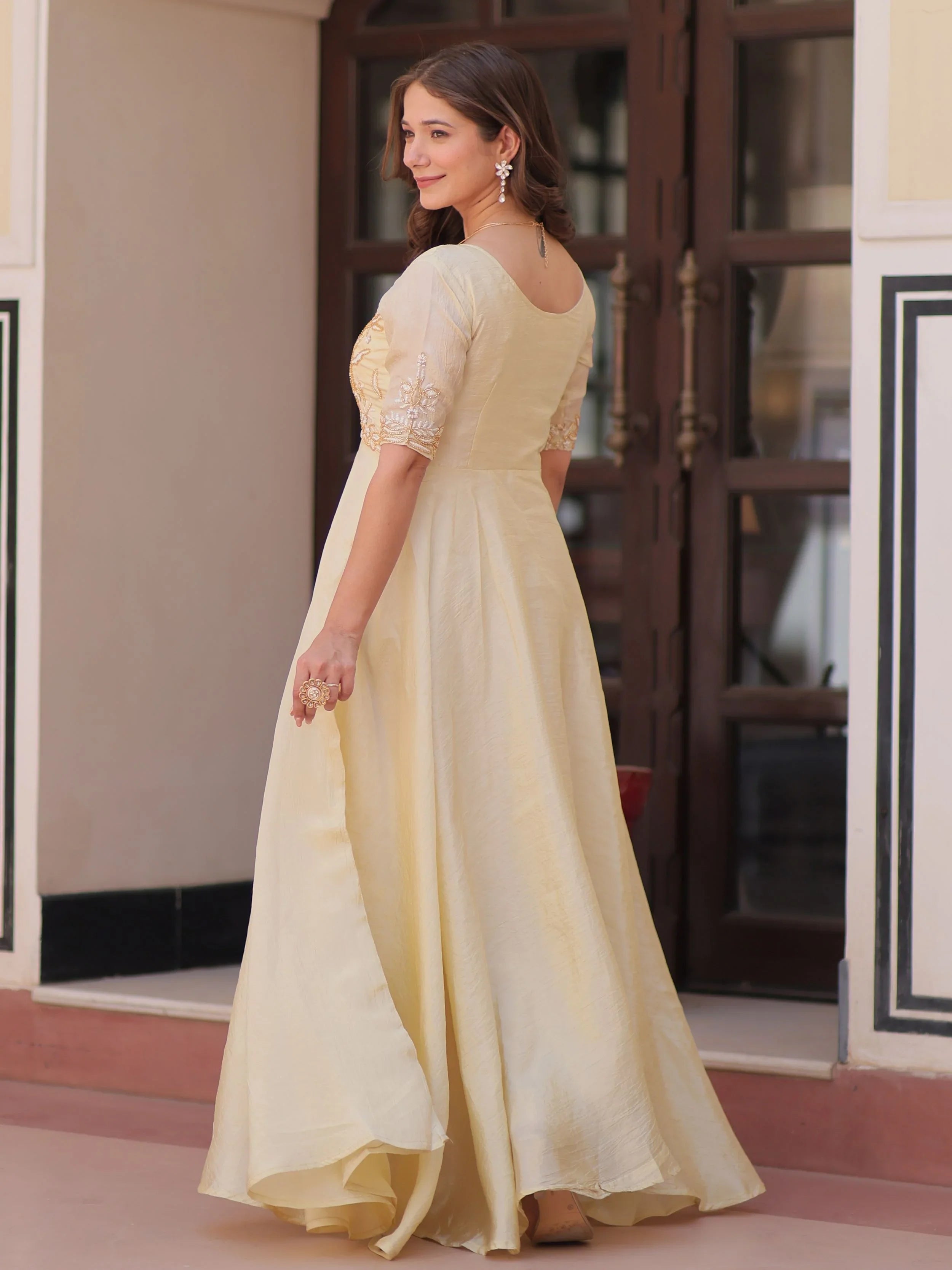 Light yellow gold crush umbrella flair gown with beads embroidery