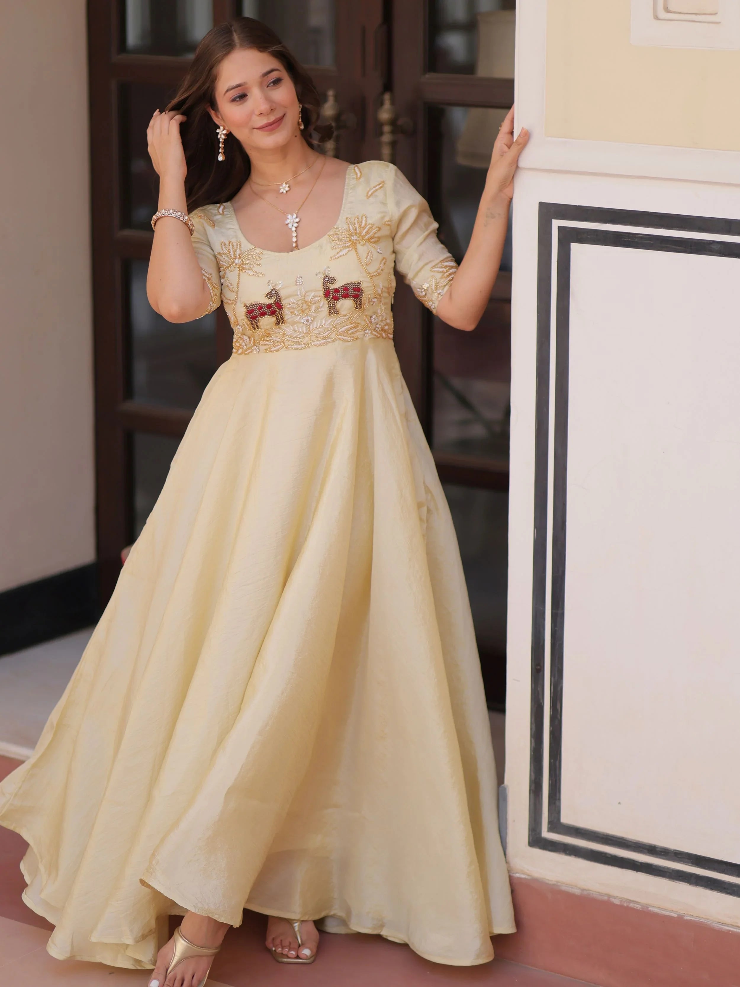 Light yellow gold crush umbrella flair gown with beads embroidery