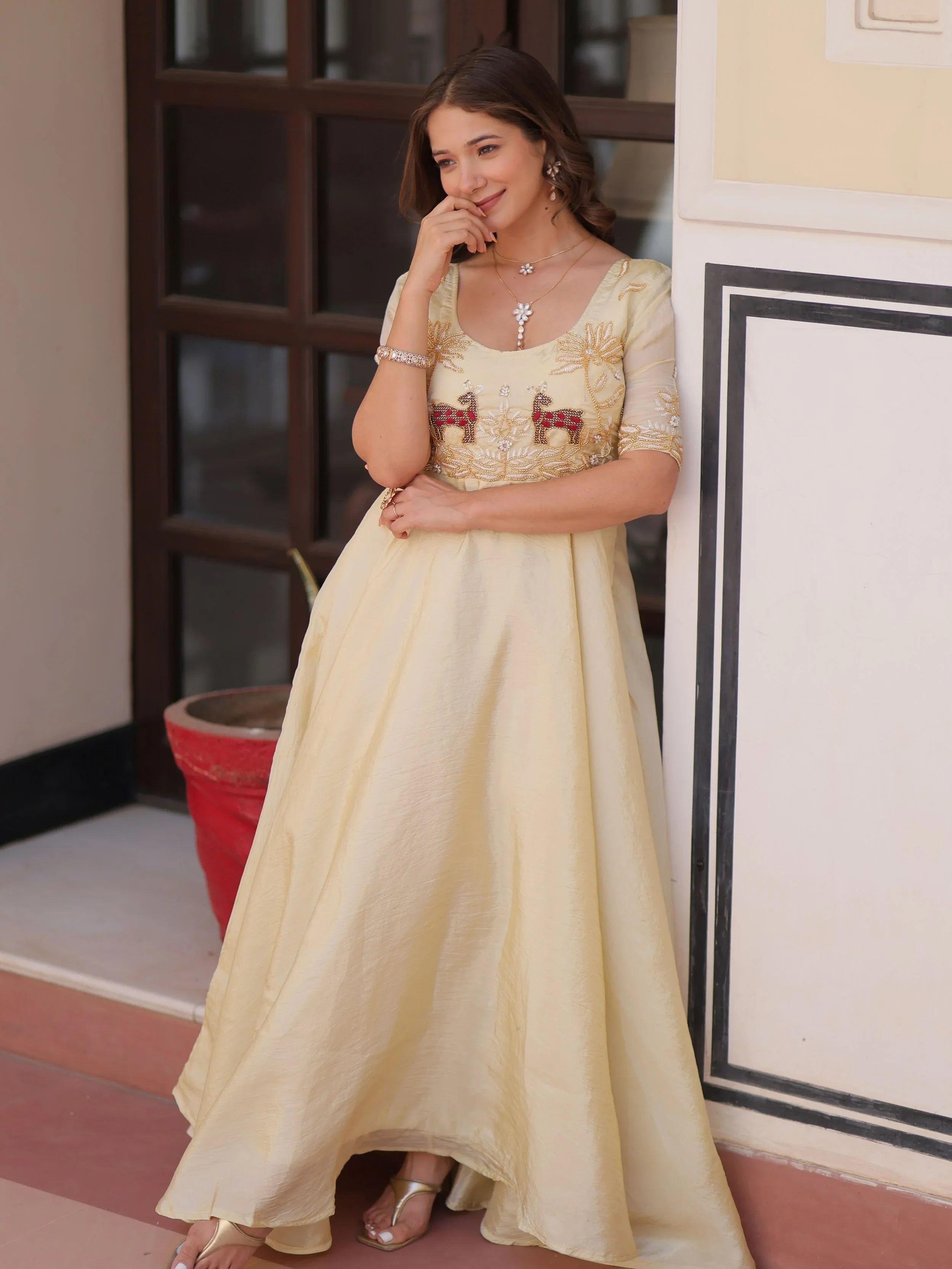 Light yellow gold crush umbrella flair gown with beads embroidery