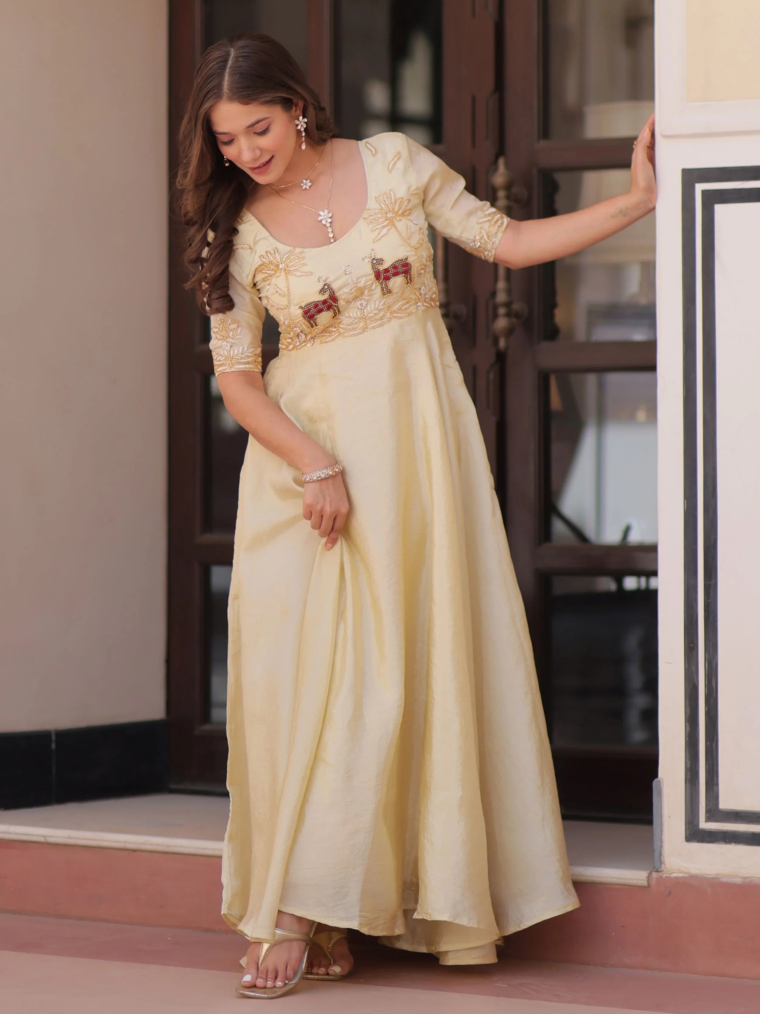 Light yellow gold crush umbrella flair gown with beads embroidery