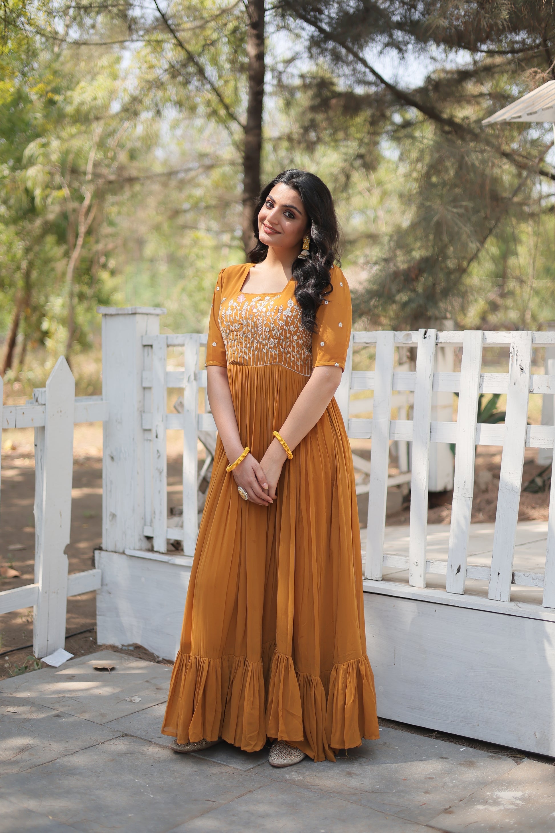Nitara mustard yellow georgette embroidered Anarkali gown
