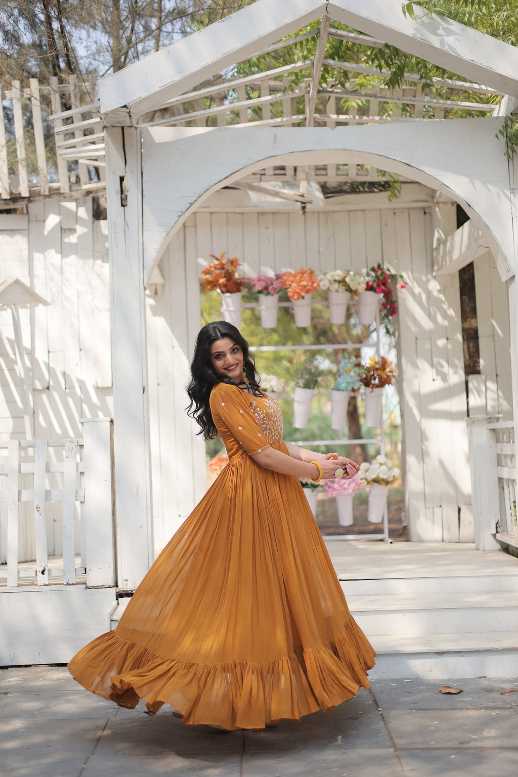 Nitara mustard yellow georgette embroidered Anarkali gown