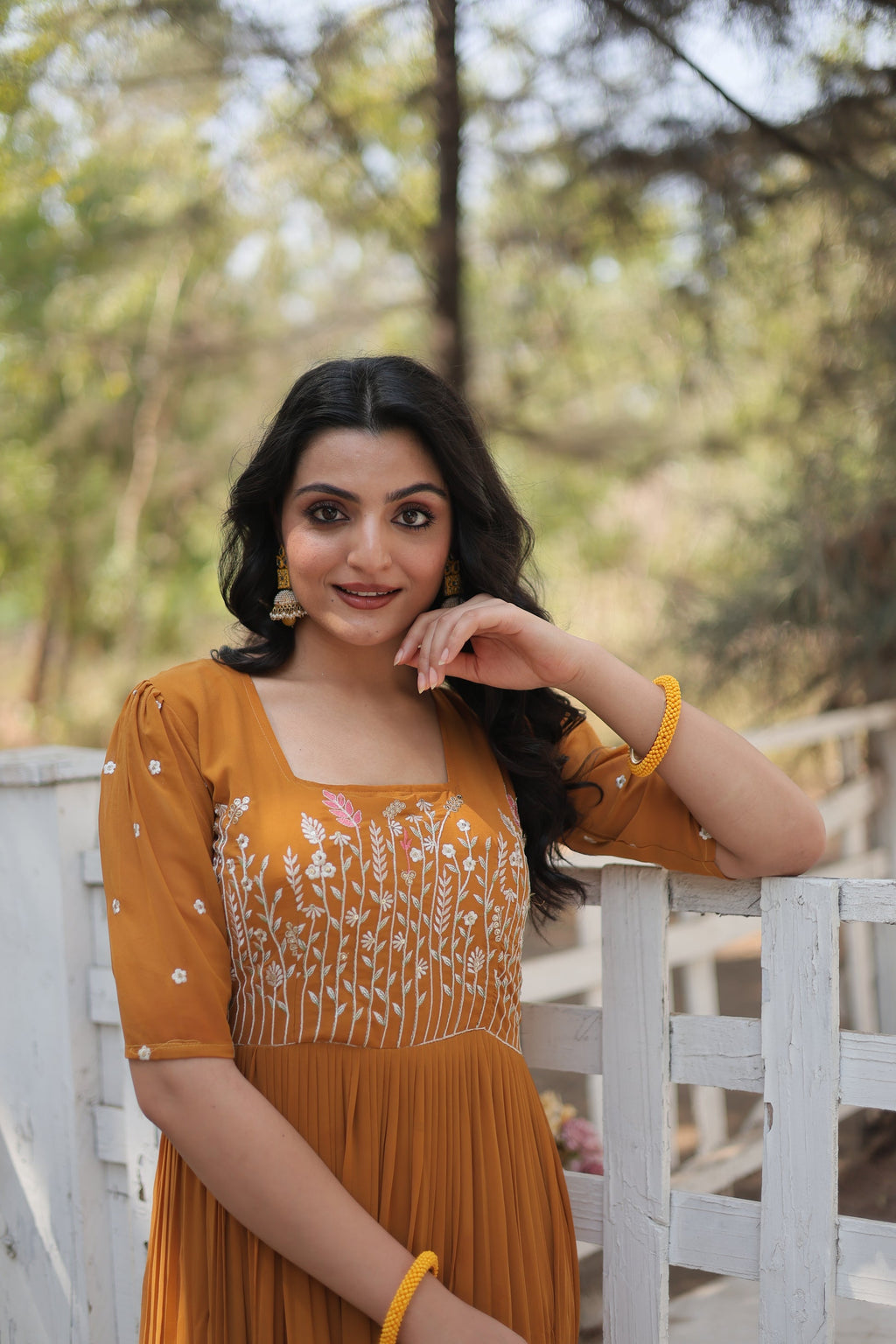 Nitara mustard yellow georgette embroidered Anarkali gown