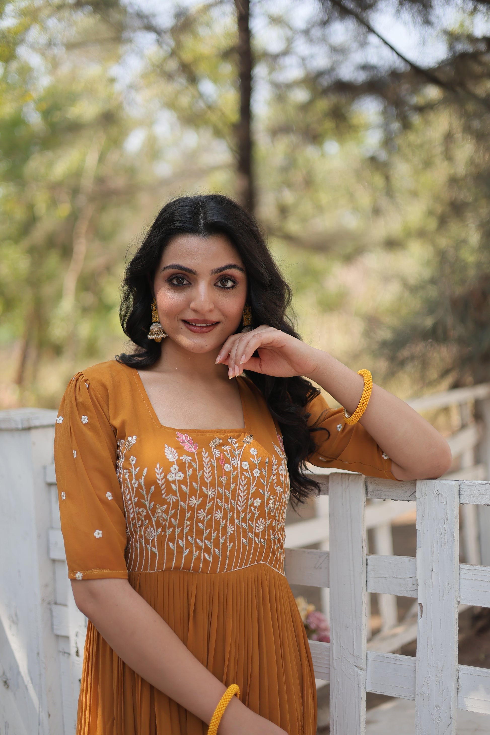 Nitara mustard yellow georgette embroidered Anarkali gown
