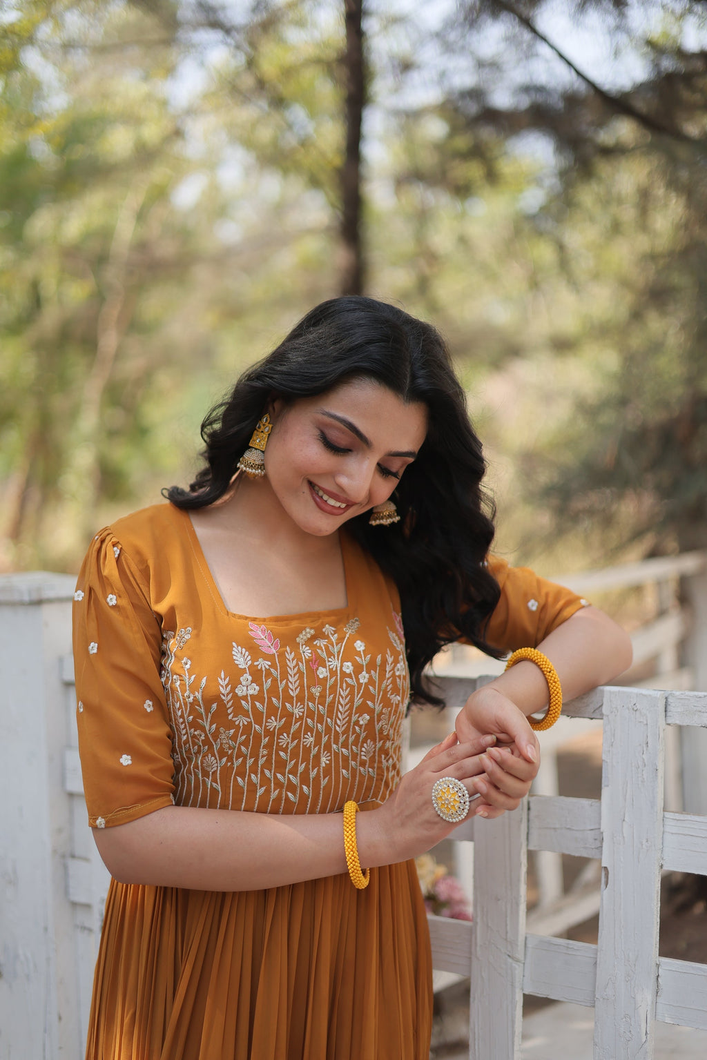 Nitara mustard yellow georgette embroidered Anarkali gown