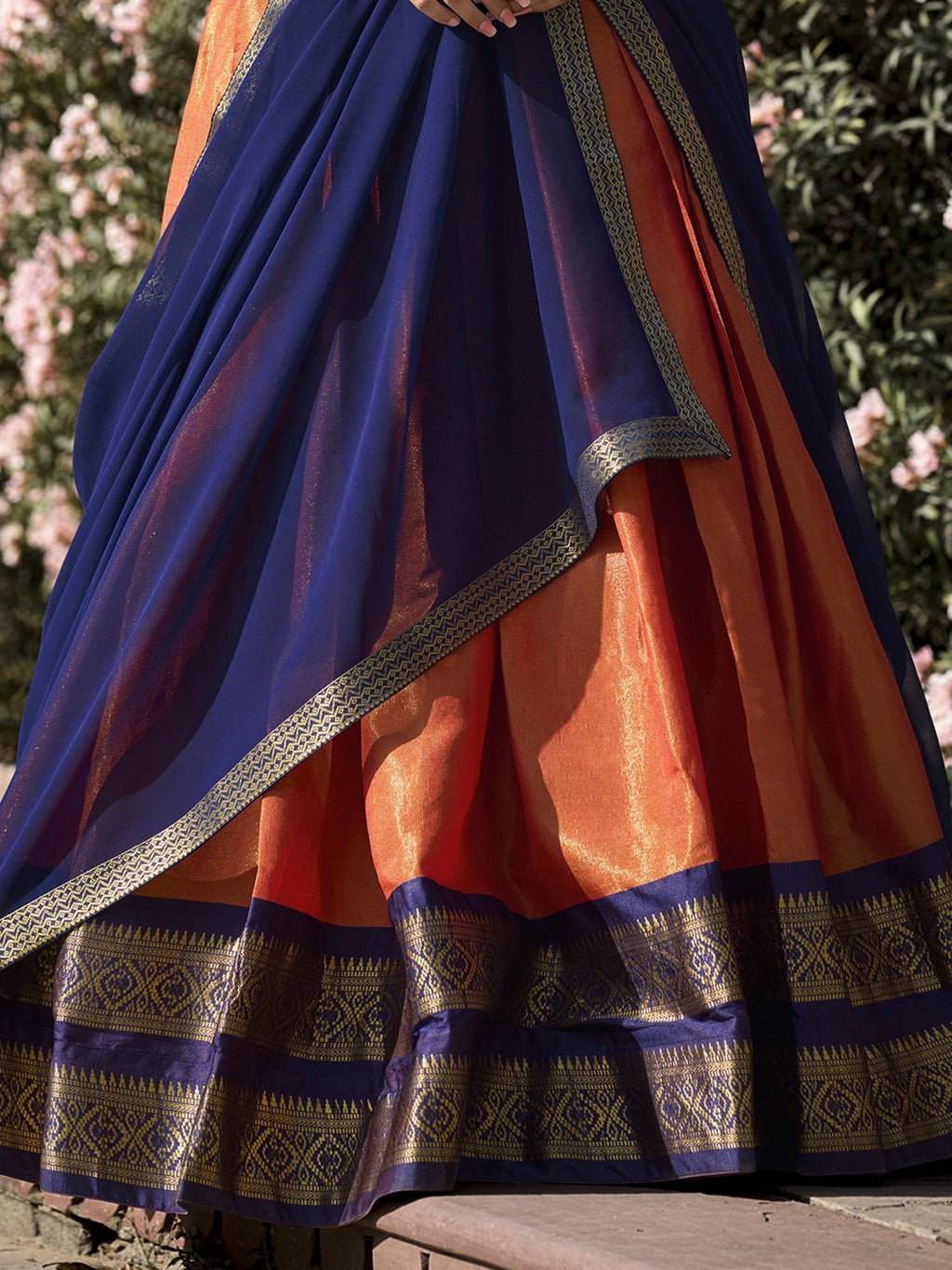 Orange kanchipuram silk lehenga choli with zari weaving work