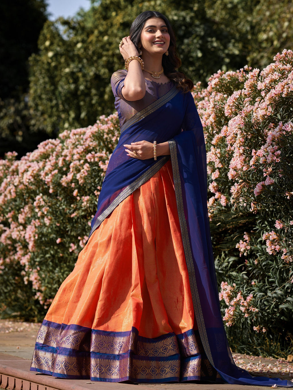 Orange kanchipuram silk lehenga choli with zari weaving work