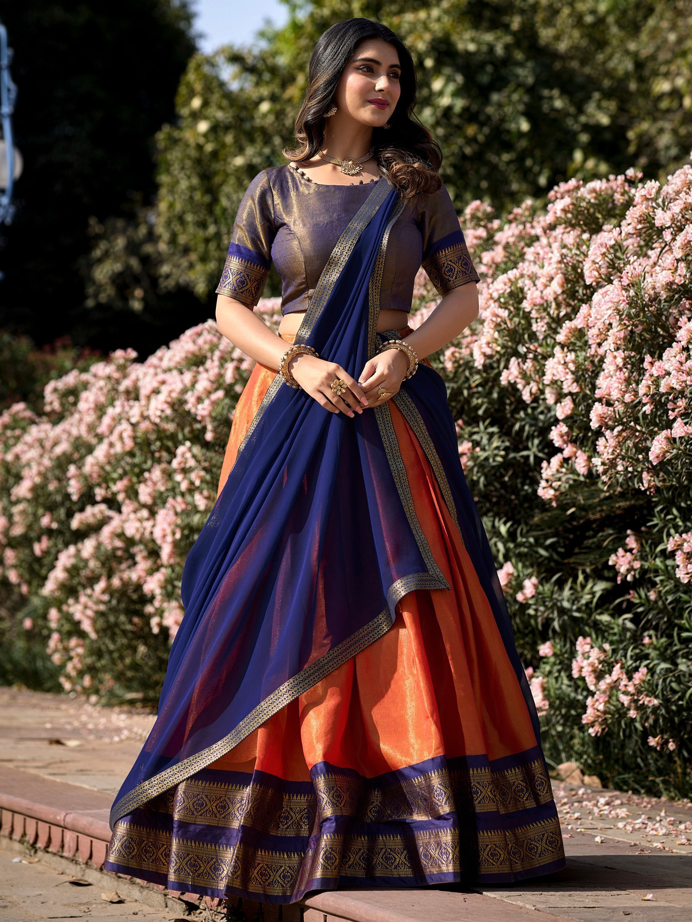 Orange kanchipuram silk lehenga choli with zari weaving work