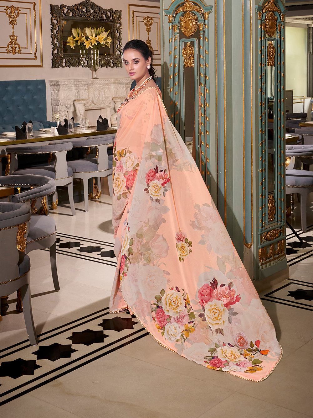 Peach georgette printed saree with pearl lace border
