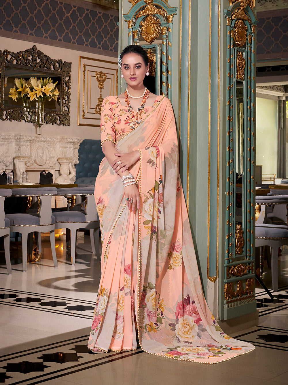 Peach georgette printed saree with pearl lace border