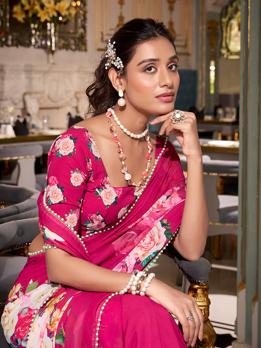 Pink georgette printed saree with pearl lace border