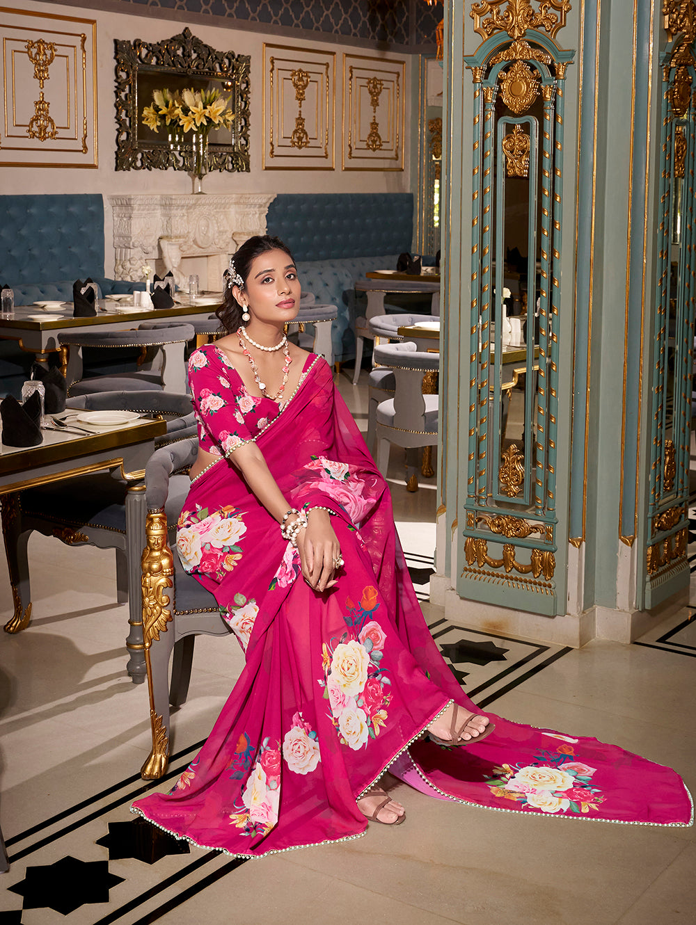 Pink georgette printed saree with pearl lace border