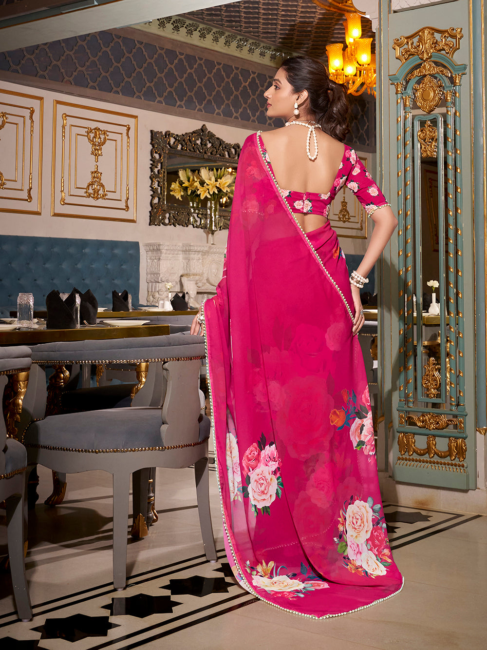Pink georgette printed saree with pearl lace border