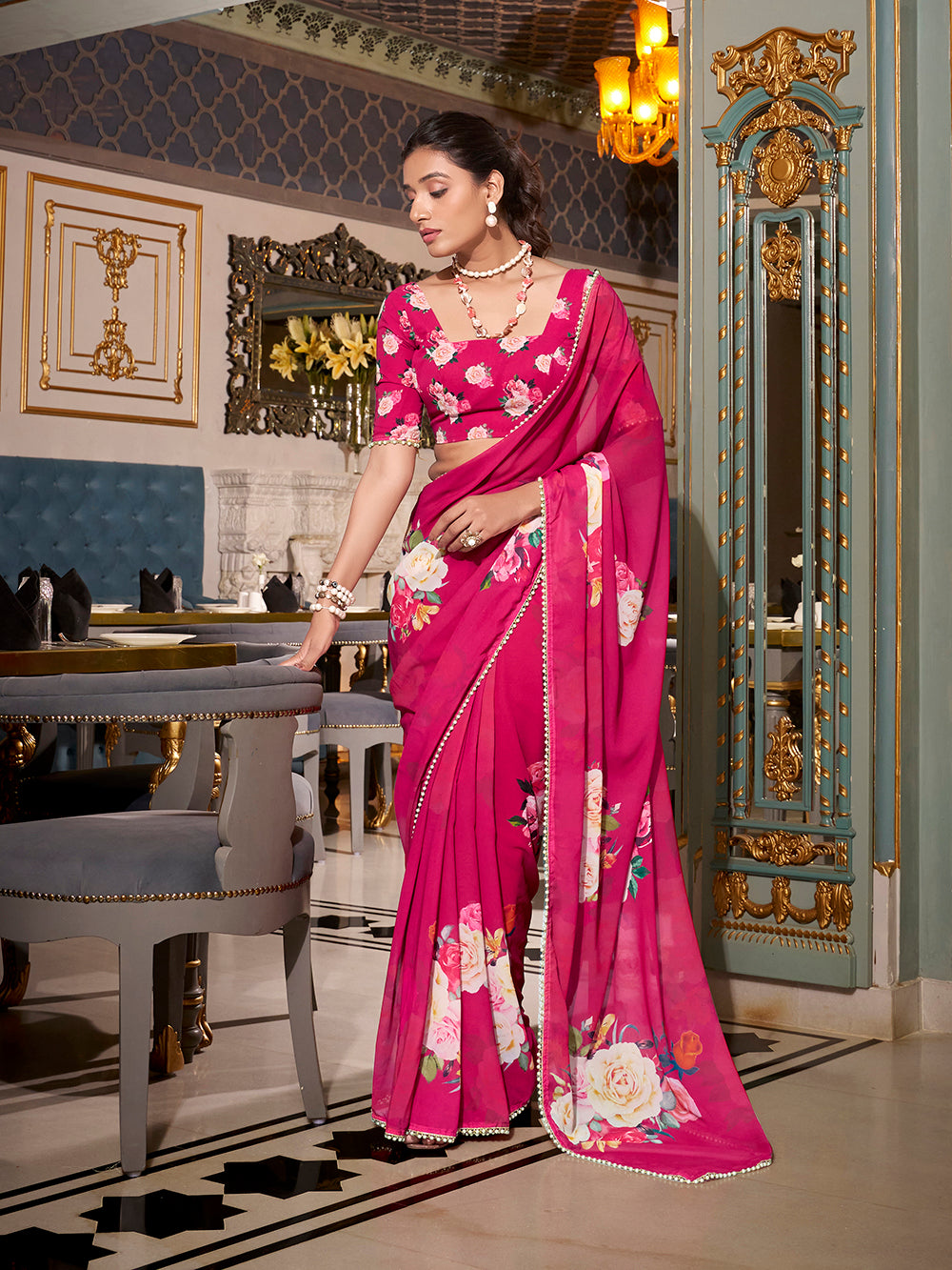 Pink georgette printed saree with pearl lace border