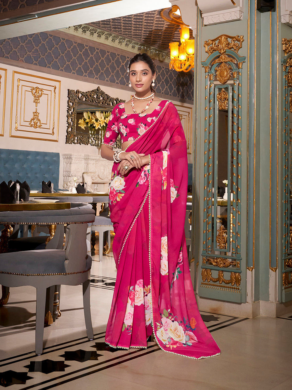 Pink georgette printed saree with pearl lace border