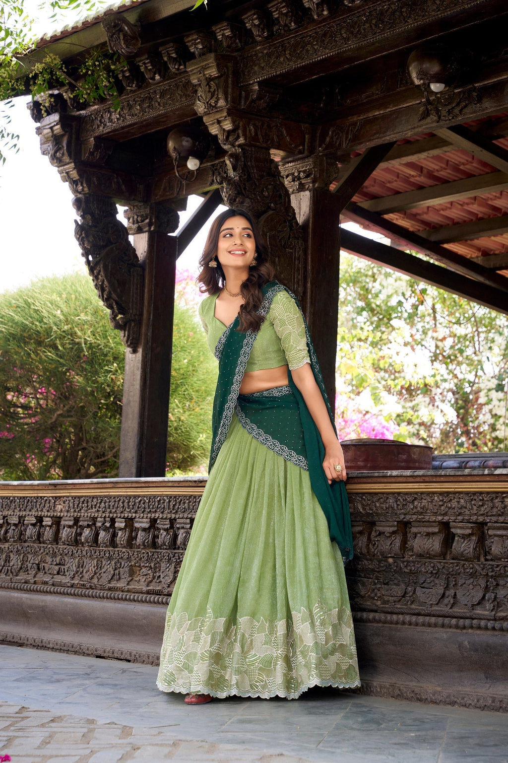 Pista green glossy lehenga choli with silver embroidery and hotfix work