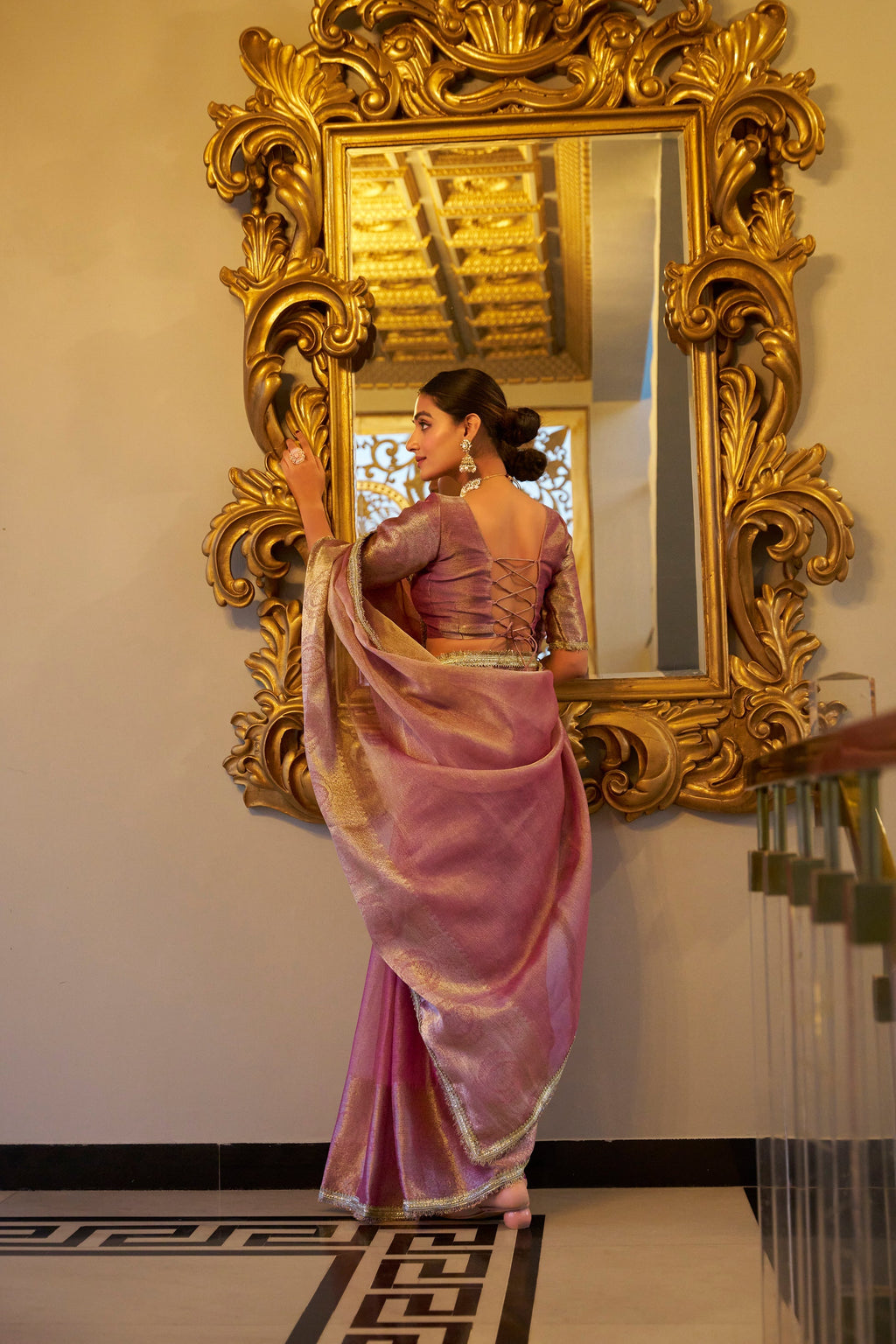 Poorvi light pink tissue shimmer zari weaving saree