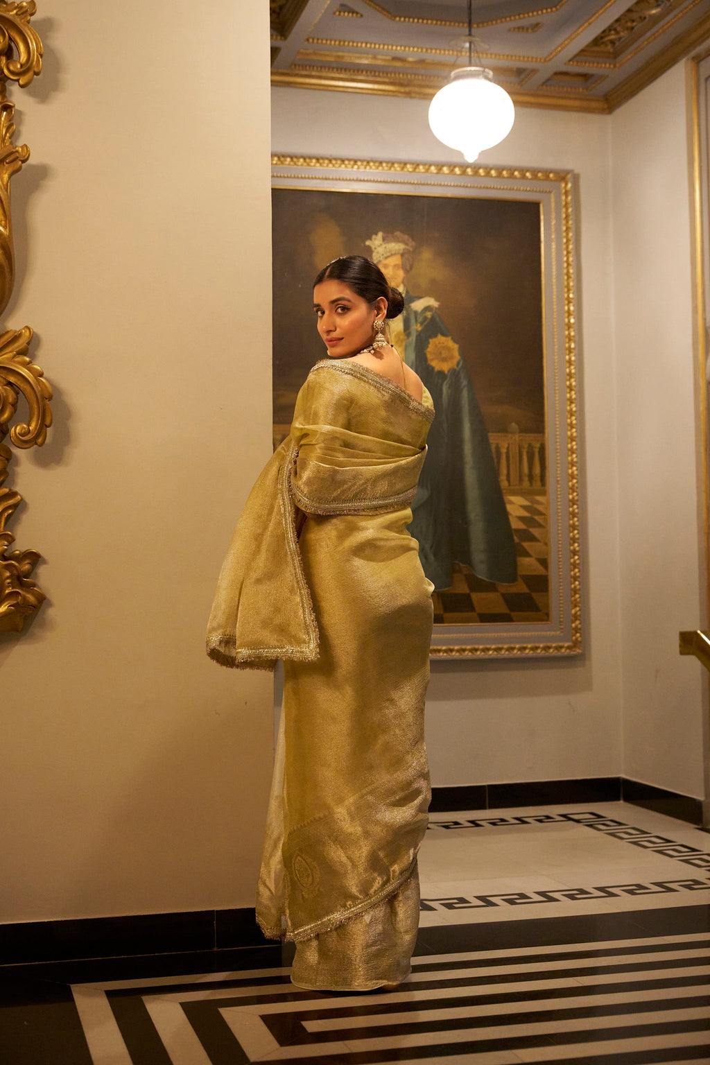 Poorvi golden tissue shimmer zari weaving saree
