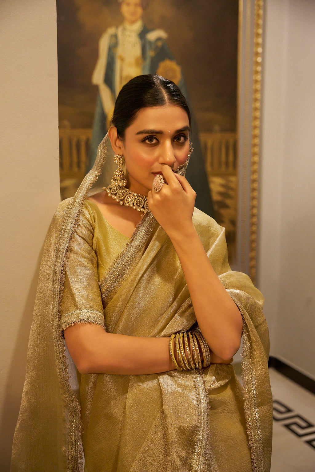 Poorvi golden tissue shimmer zari weaving saree