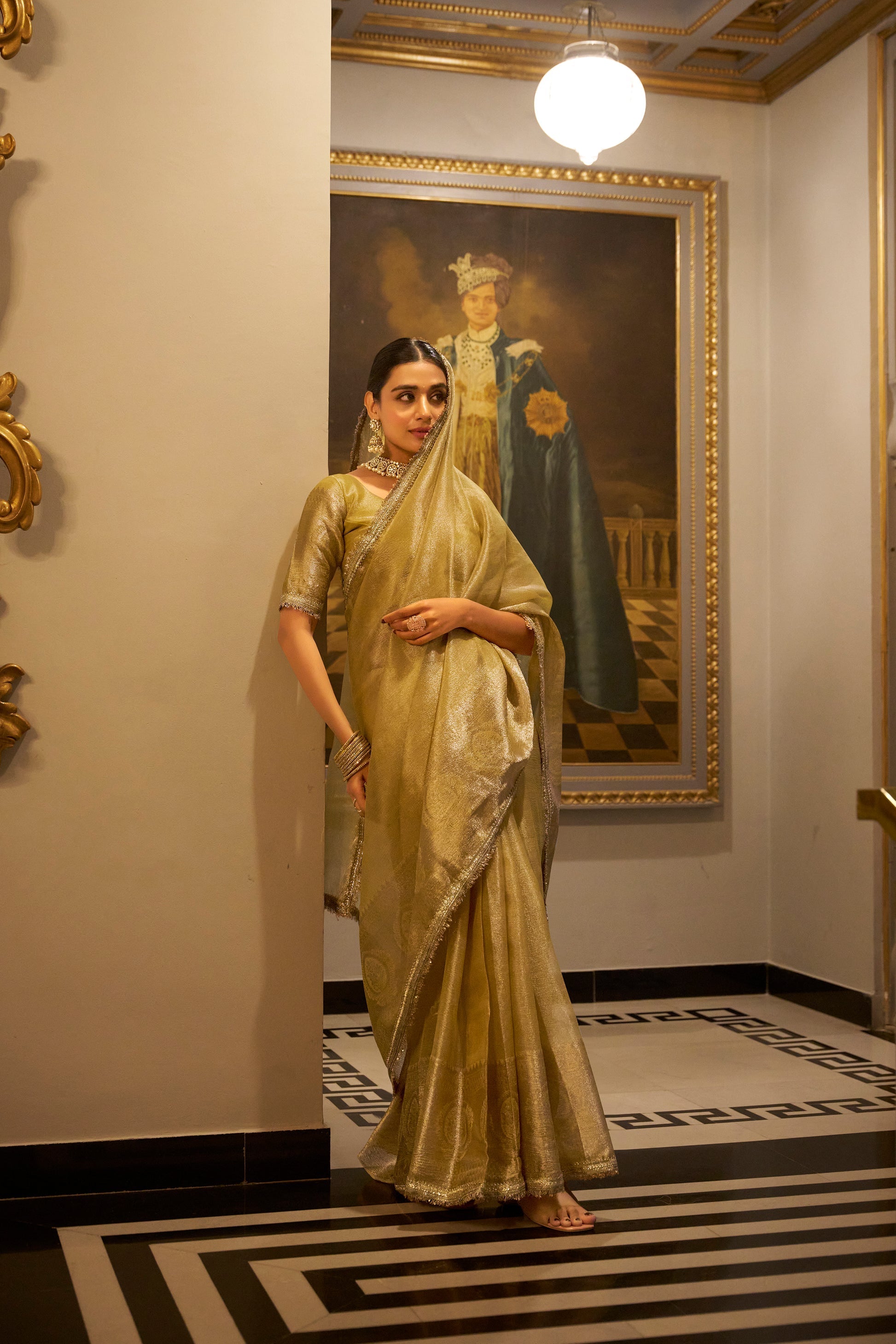 Poorvi golden tissue shimmer zari weaving saree
