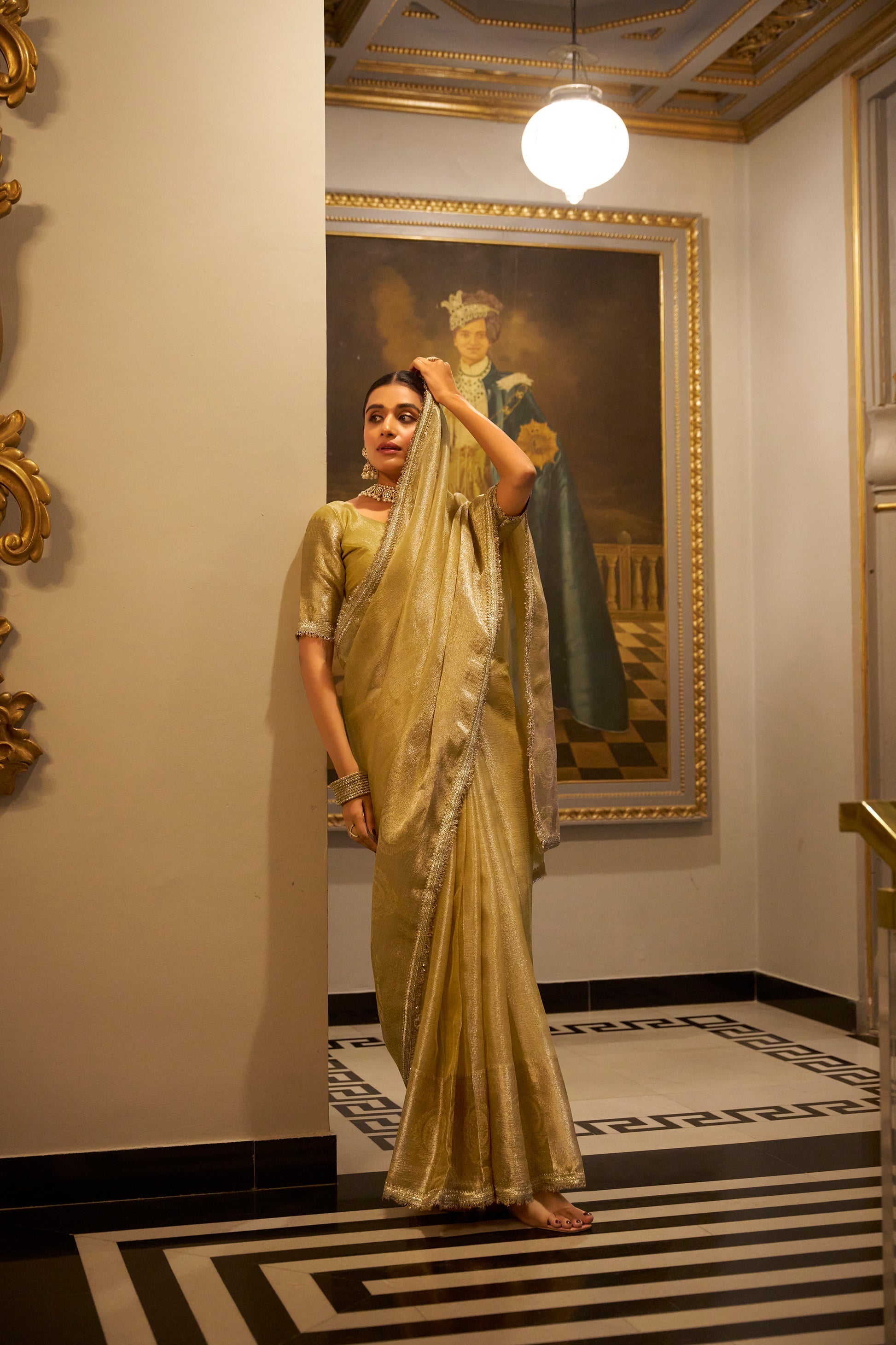Poorvi golden tissue shimmer zari weaving saree