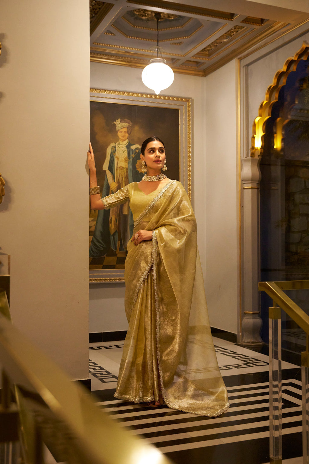 Poorvi golden tissue shimmer zari weaving saree