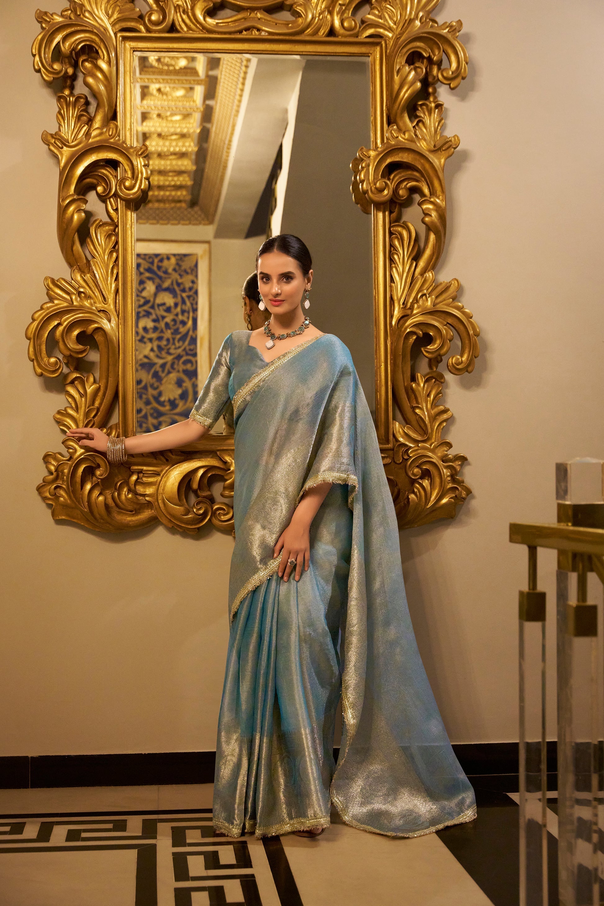 Poorvi sky blue tissue shimmer zari weaving saree