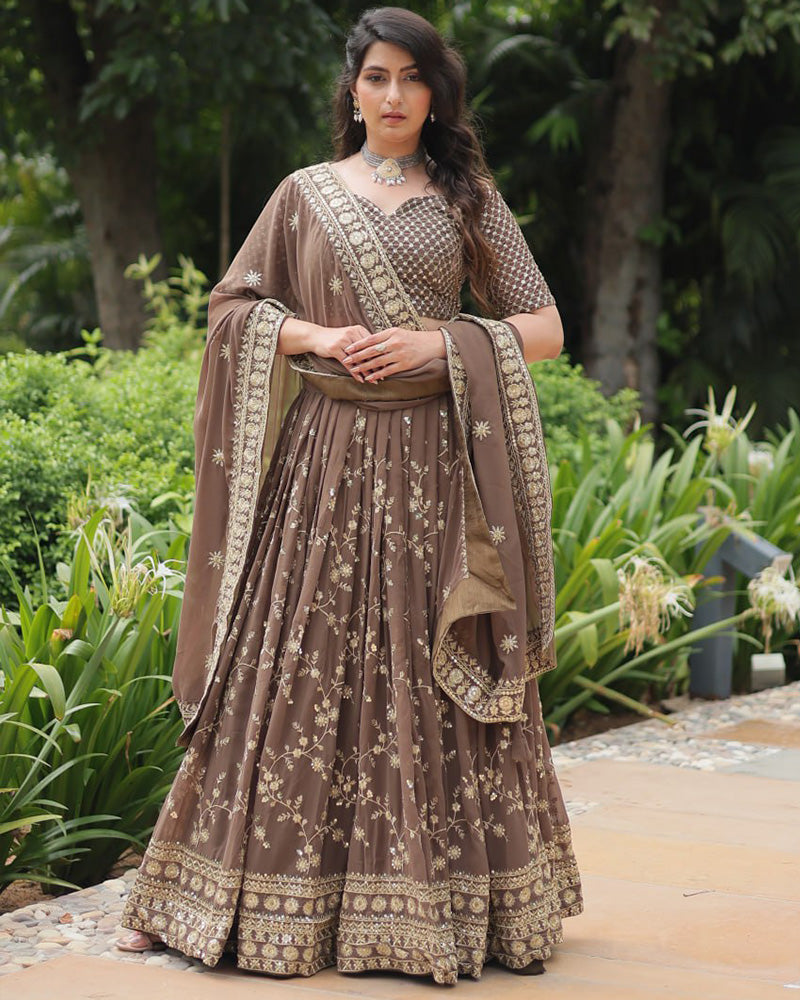 Rasika Brown Embroidered Designer Lehenga Choli with Heavy Sequins Work, Faux Blooming Fabric, and Faux Georgette Dupatta – Perfect for Weddings & Festive Wear.
