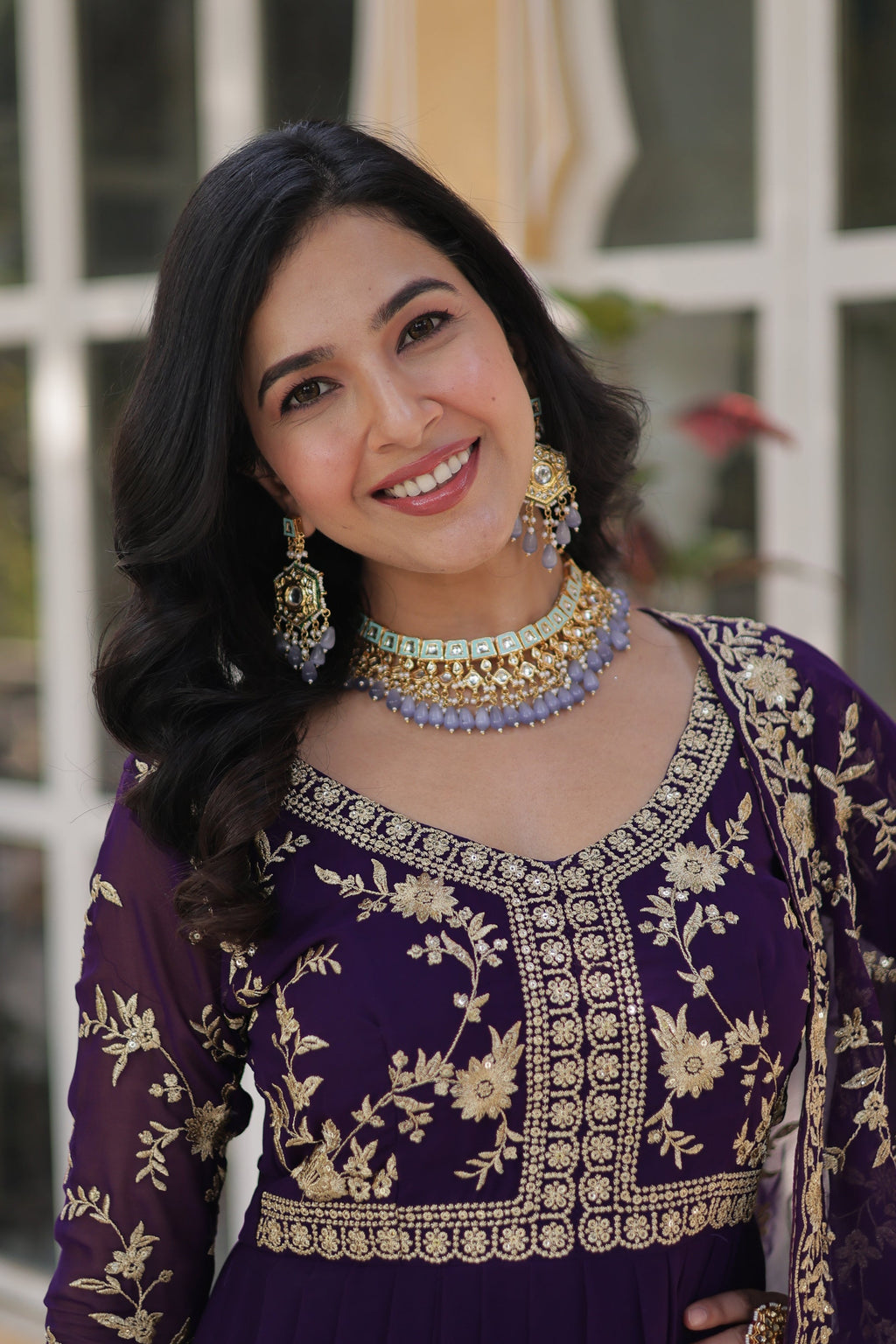  Shivangi purple embroidered Anarkali gown set featuring faux blooming fabric, zari and multi-sequins work, 3/4 sleeves, and a designer neck, paired with embroidered faux georgette dupatta – ideal ethnic outfit for weddings, festivals, and party wear in 2025.