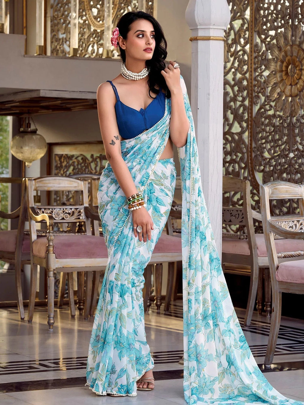 Sky blue chiffon floral print pearl lace border saree with blouse