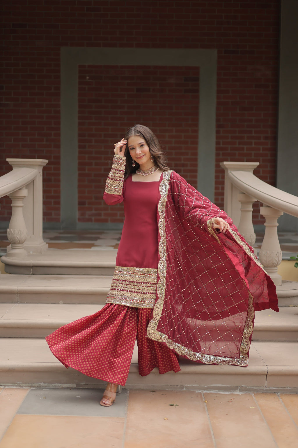 Maroon georgette embroidered Tishya designer sharara suit