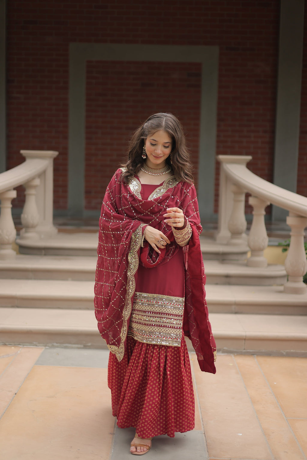 Maroon georgette embroidered Tishya designer sharara suit