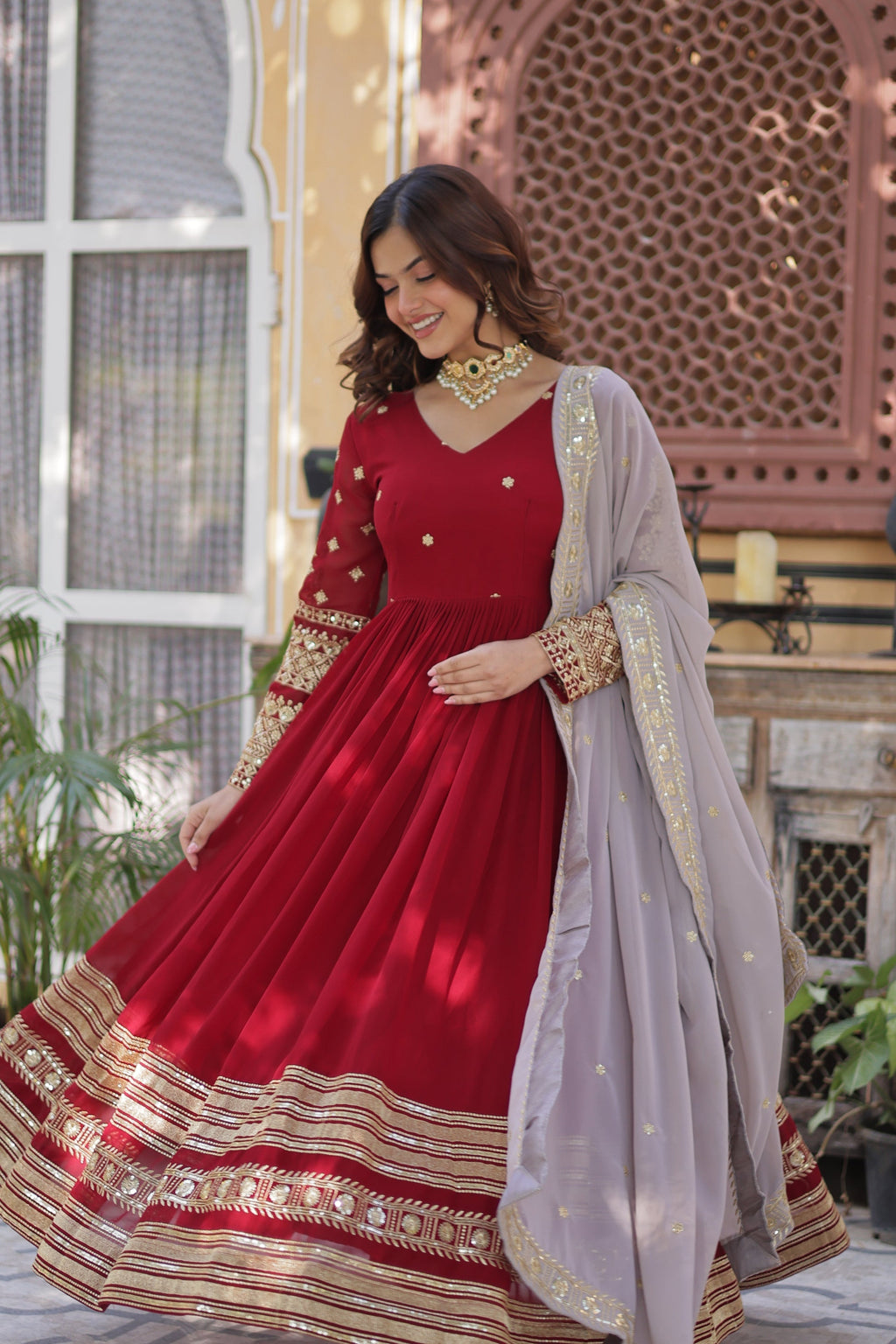Varshini red embroidered anarkali gown set