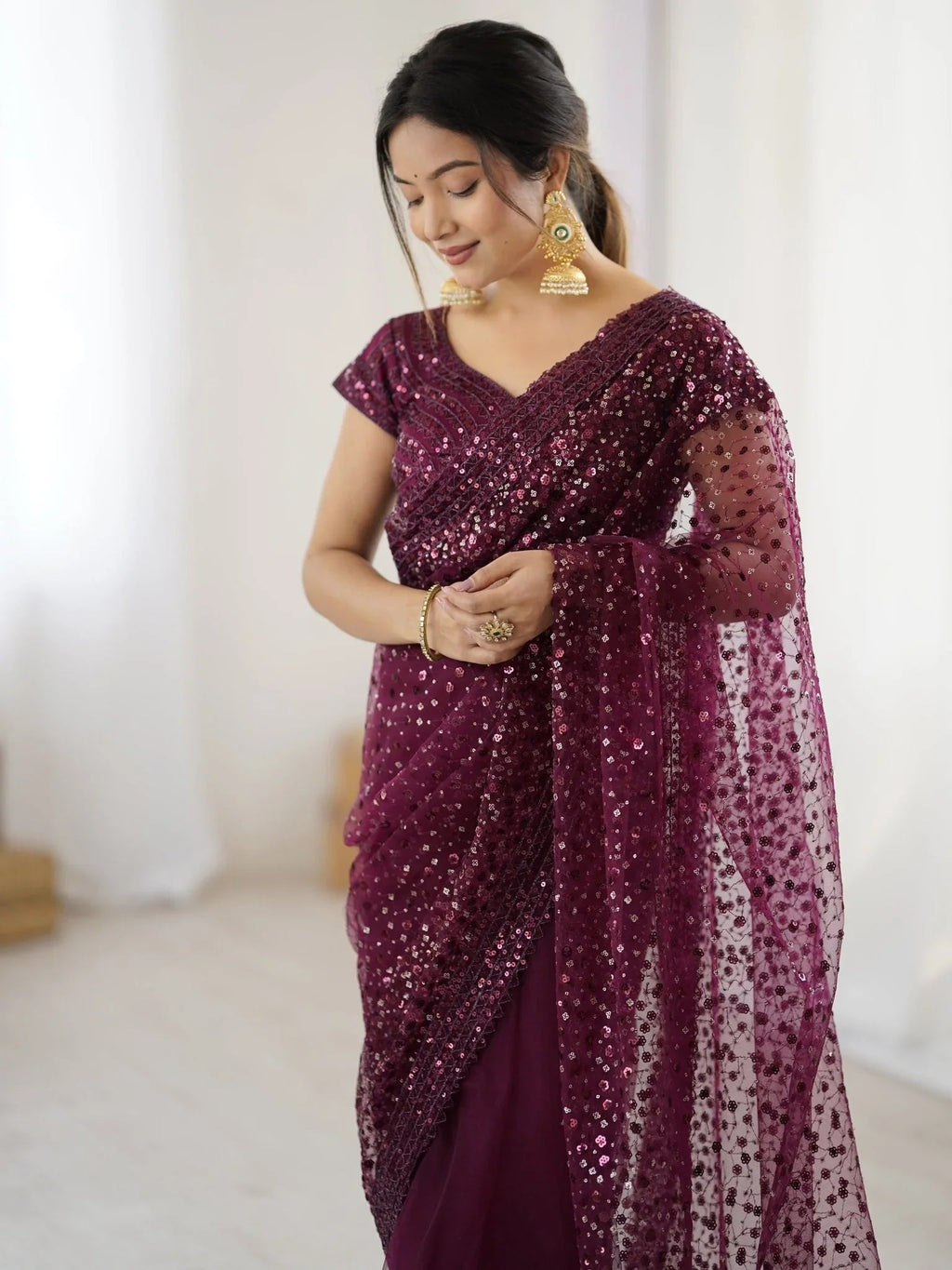 Wine net saree with sequins embroidery and blouse