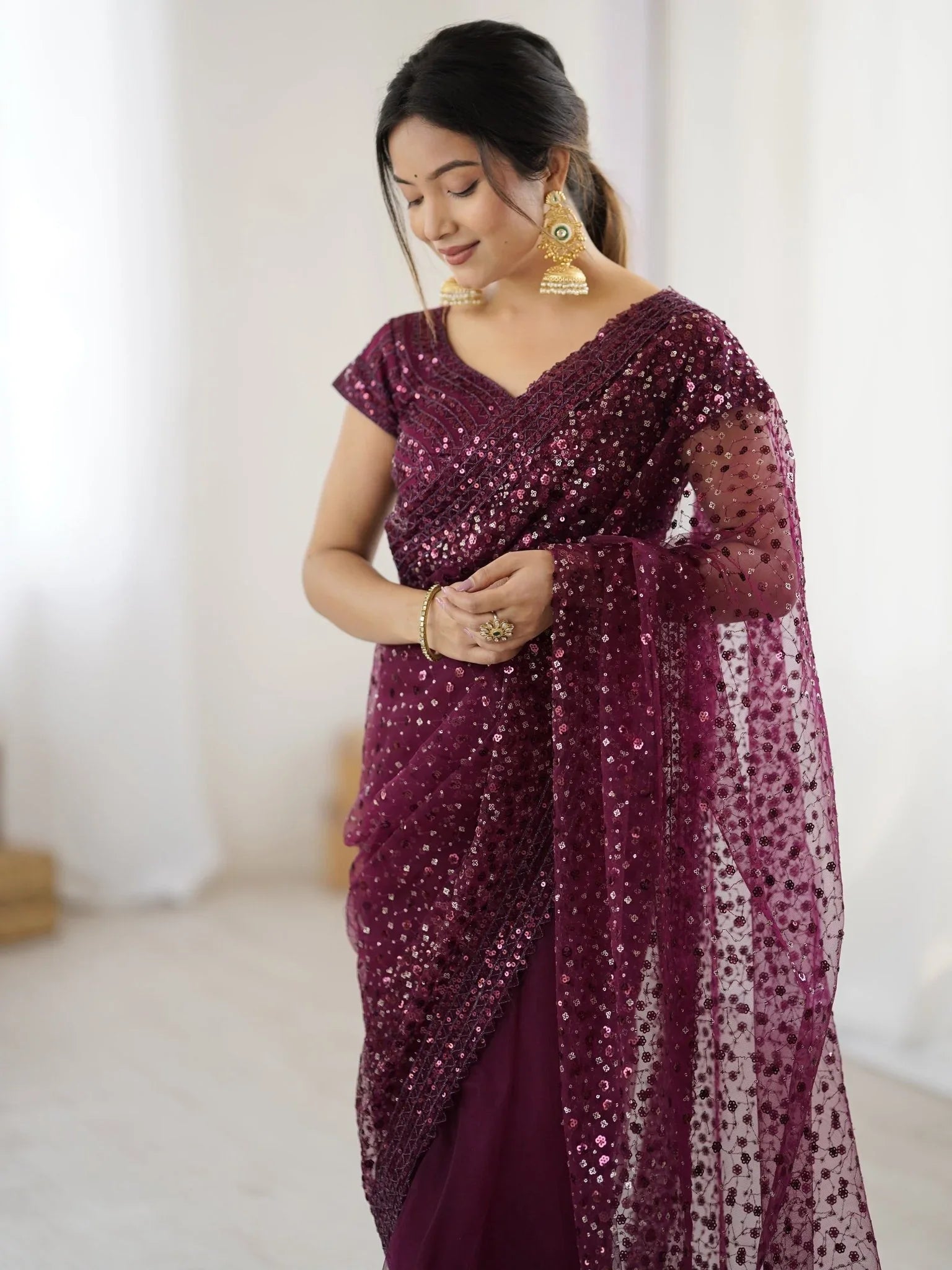 Wine net saree with sequins embroidery and blouse