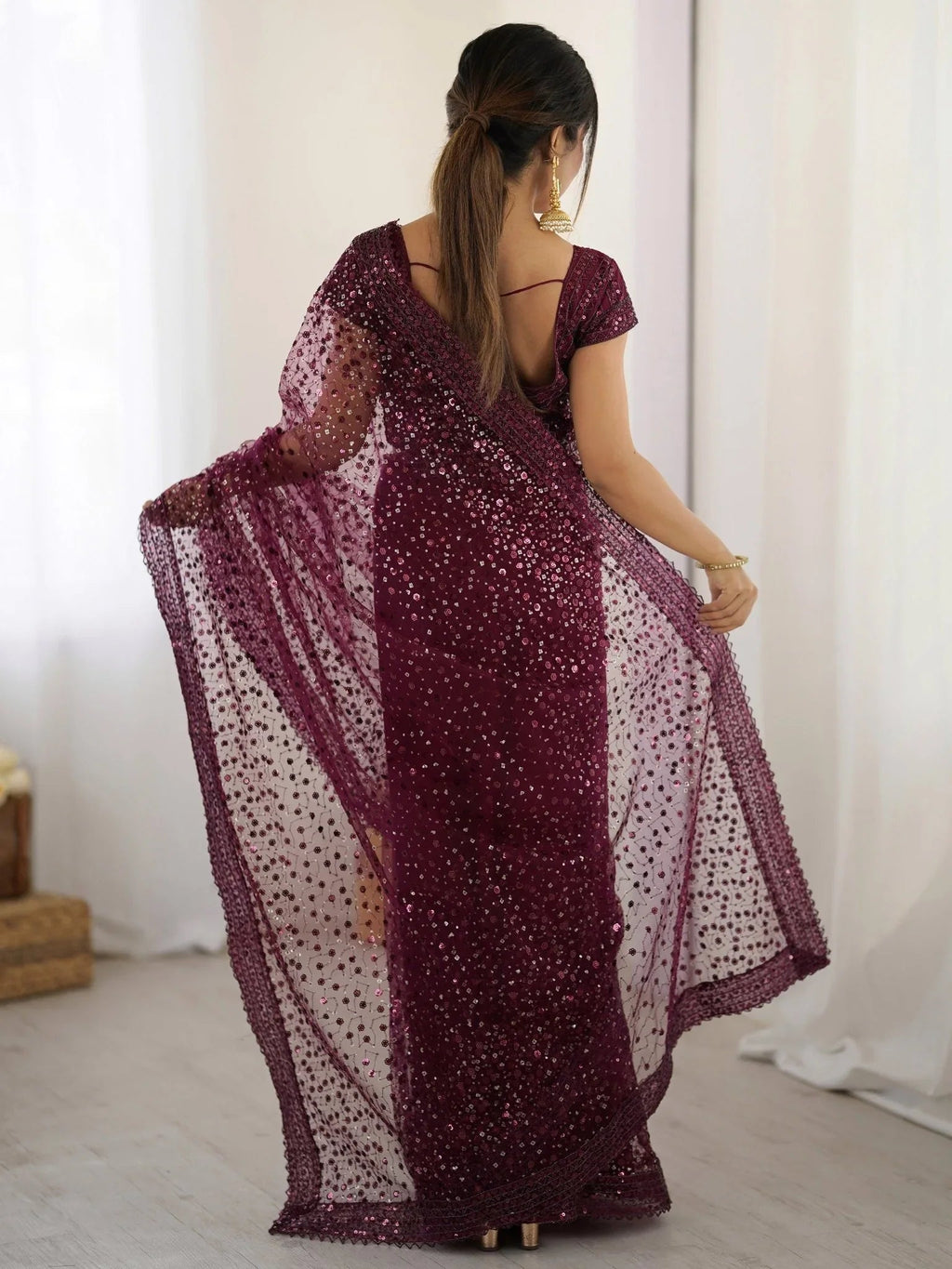 Wine net saree with sequins embroidery and blouse