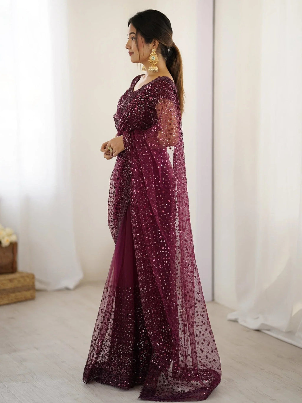 Wine net saree with sequins embroidery and blouse