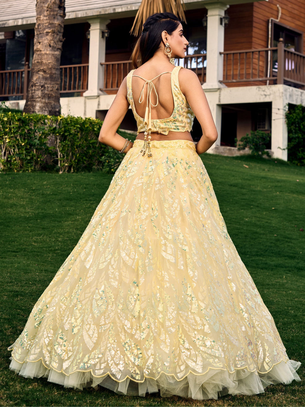 Yellow net sequins embroidered party wear lehenga choli