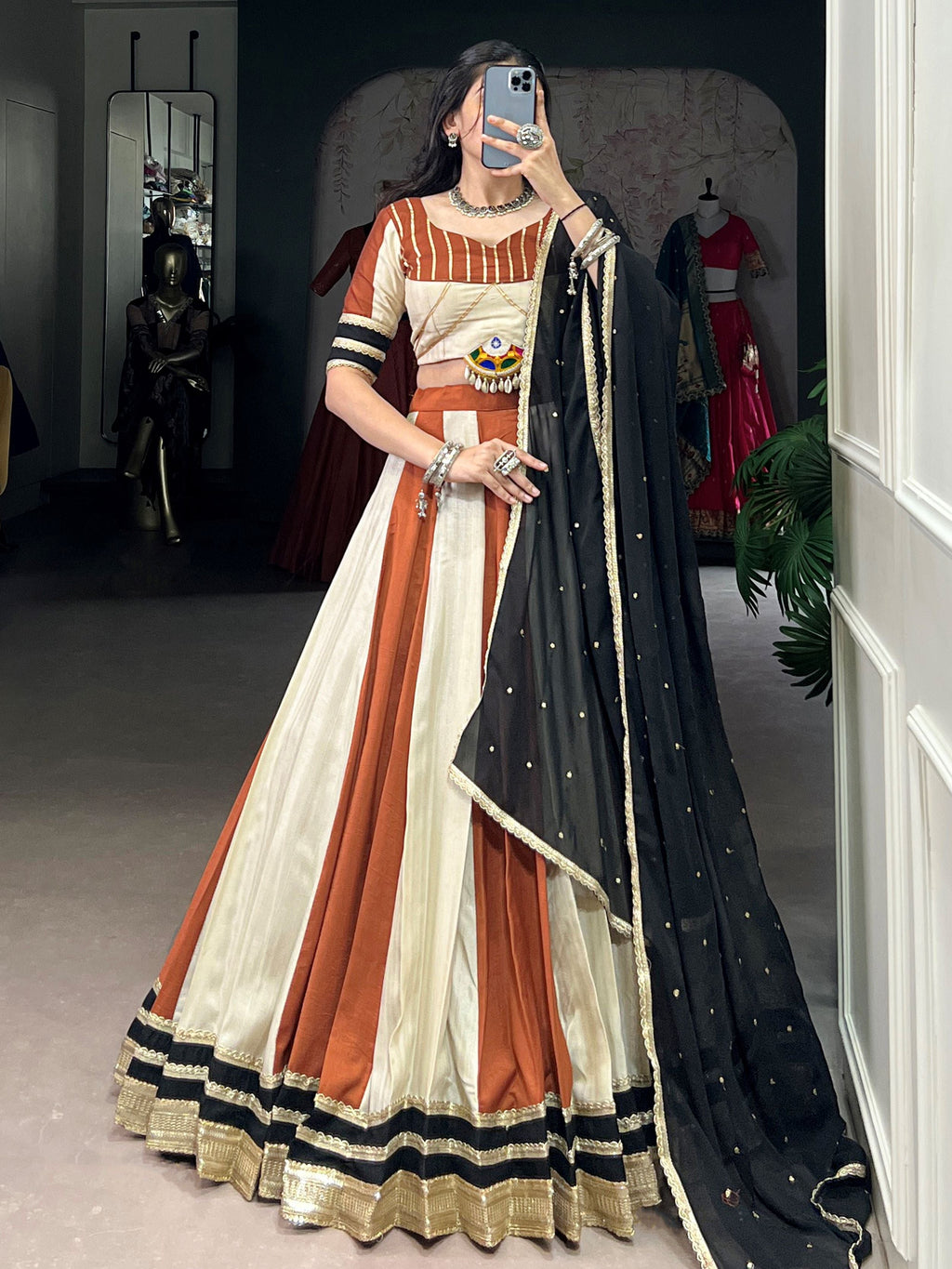Rust orange rangoli silk lehenga choli with embroidered sequins work