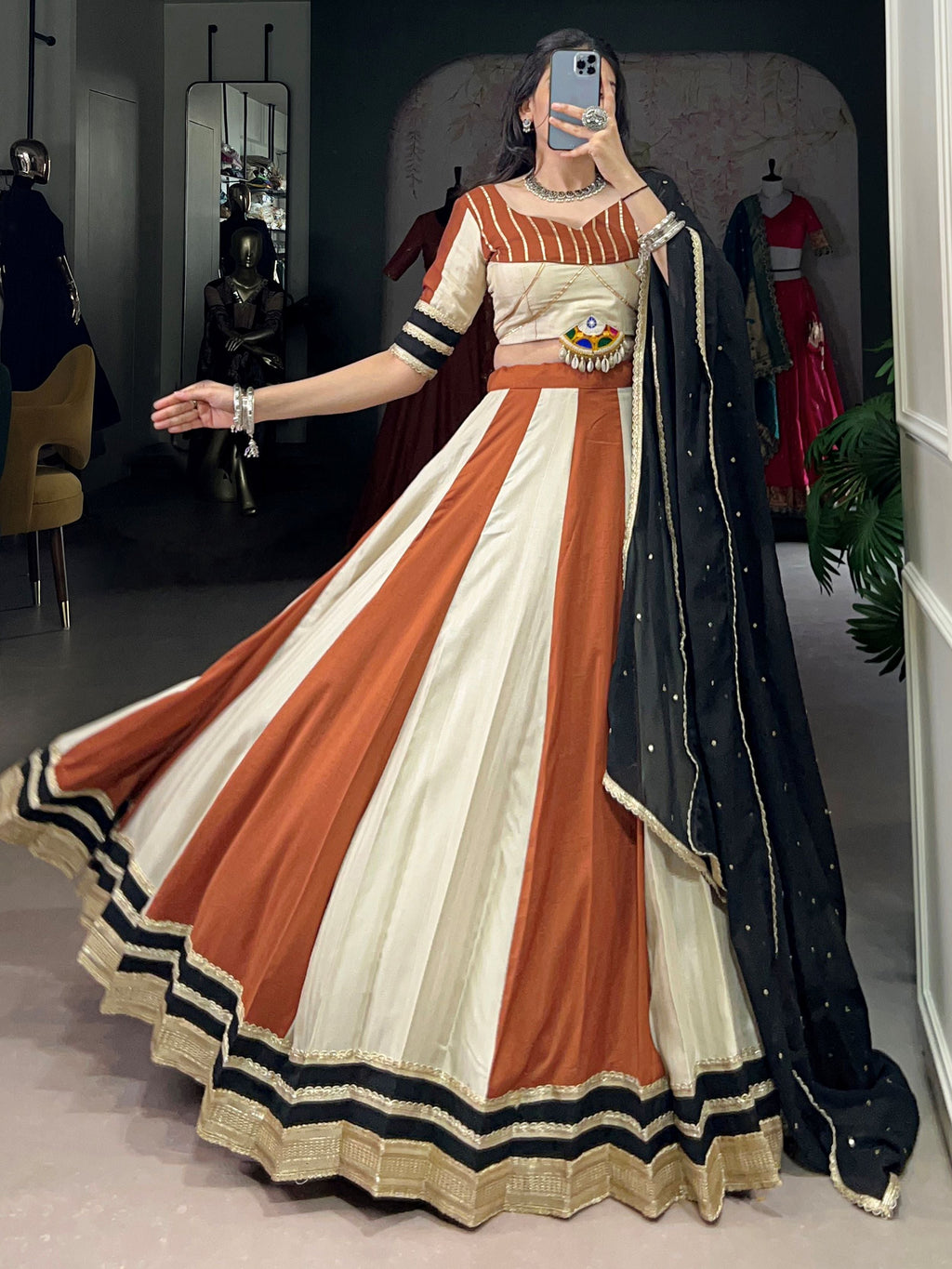 Rust orange rangoli silk lehenga choli with embroidered sequins work