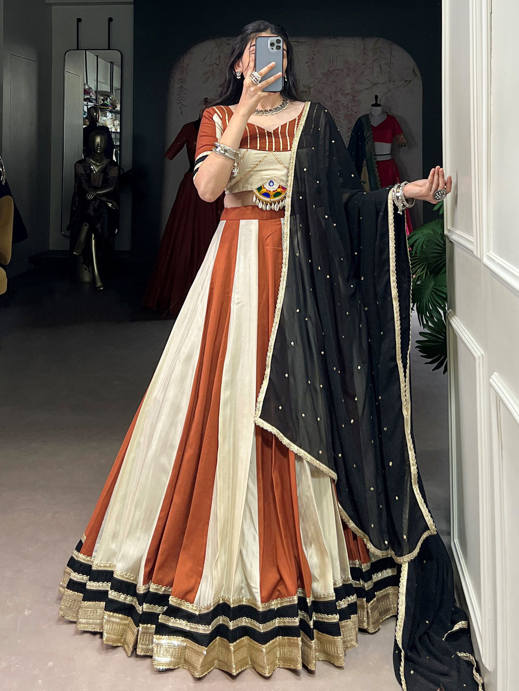 Rust orange rangoli silk lehenga choli with embroidered sequins work