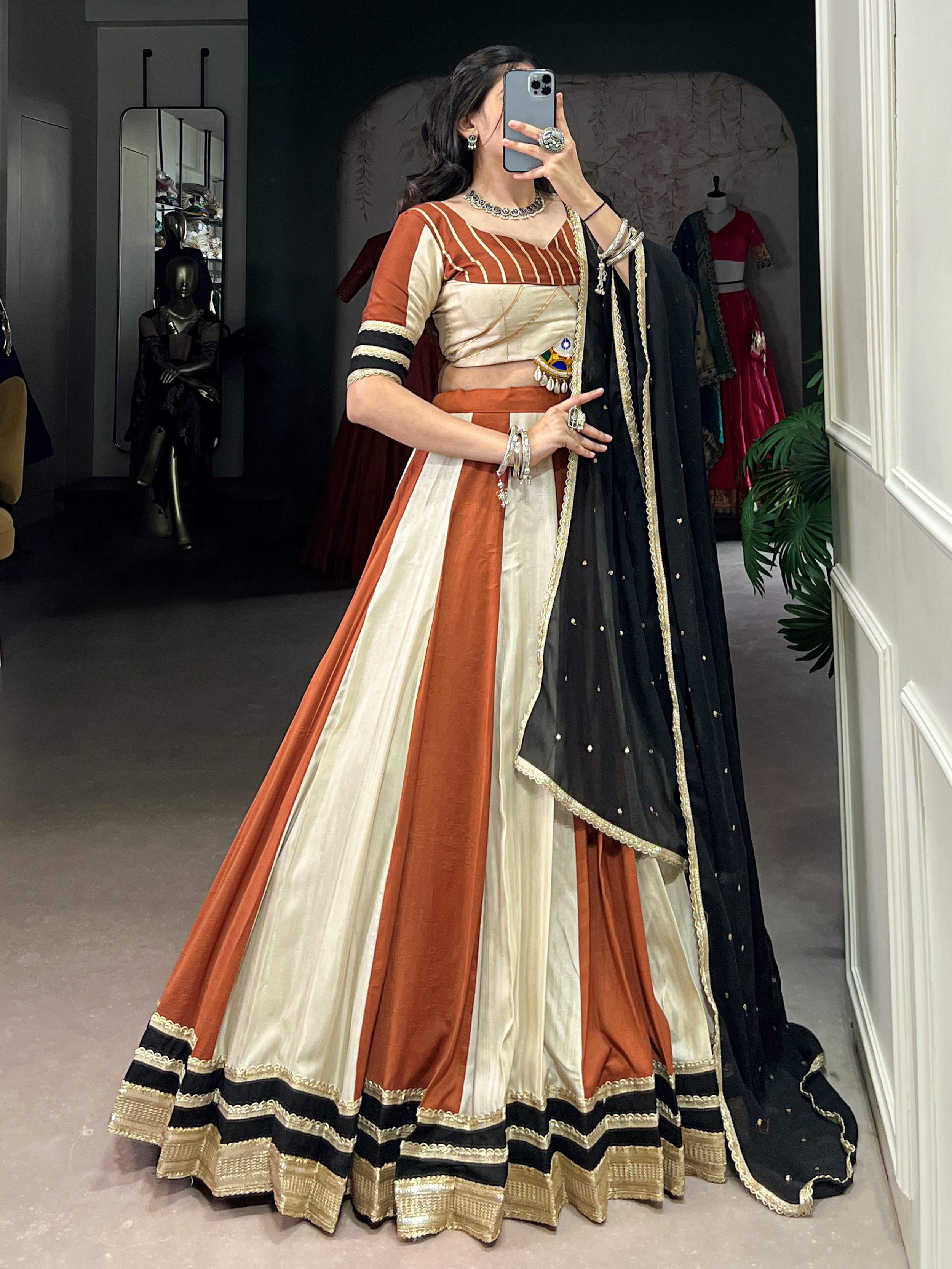 Rust orange rangoli silk lehenga choli with embroidered sequins work