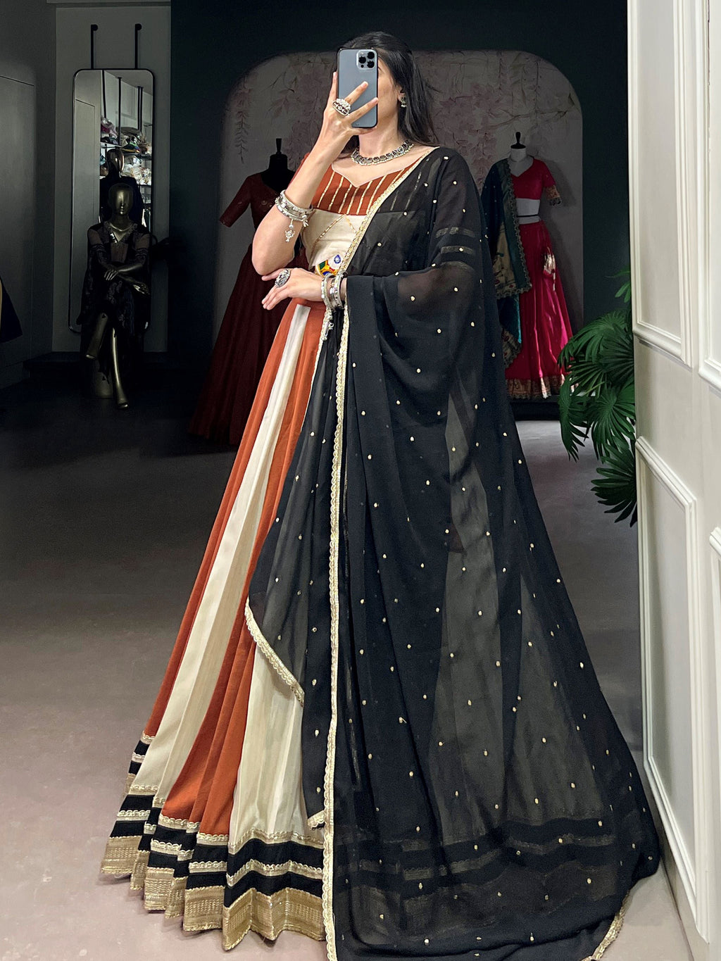 Rust orange rangoli silk lehenga choli with embroidered sequins work