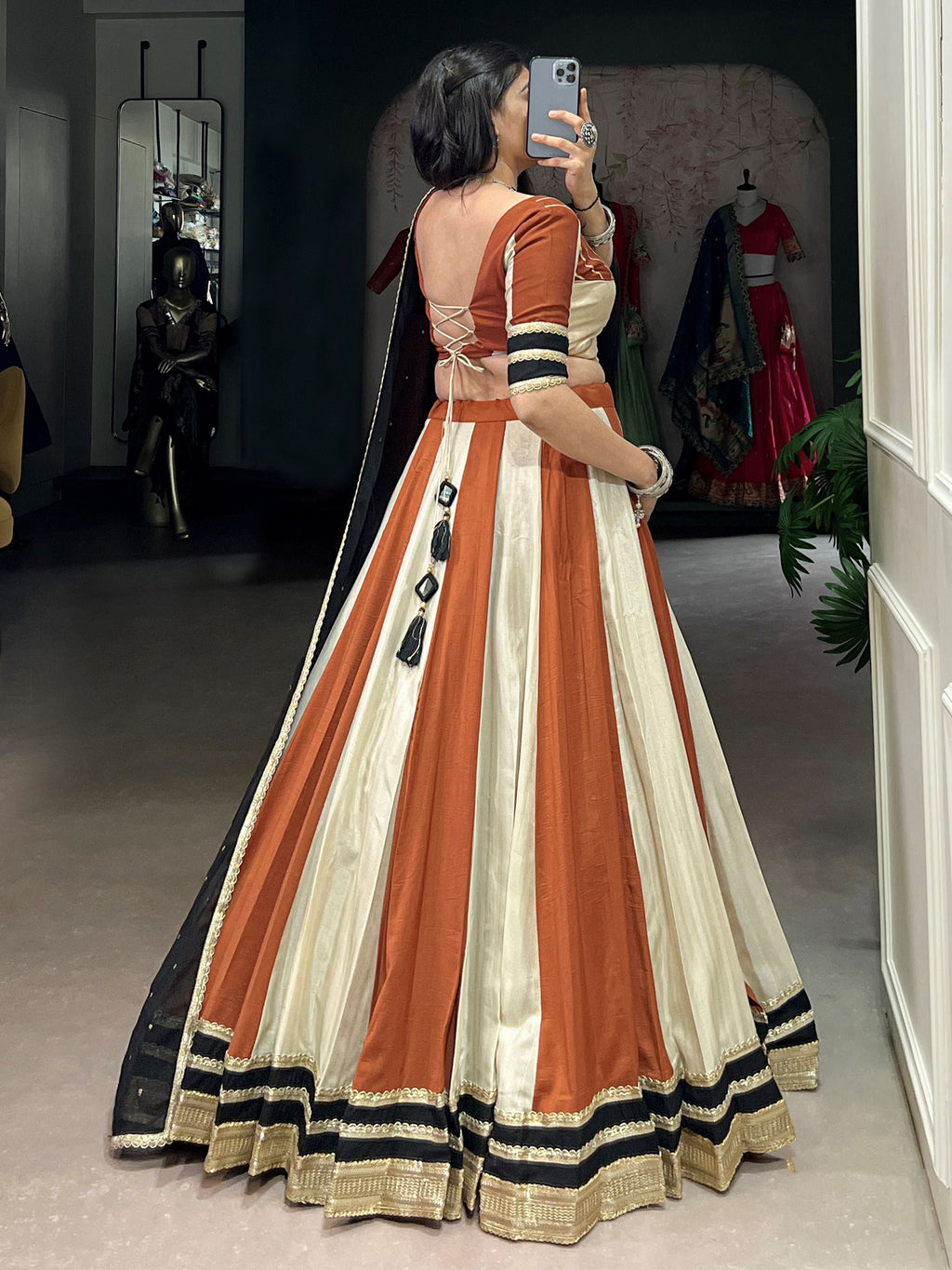 Rust orange rangoli silk lehenga choli with embroidered sequins work