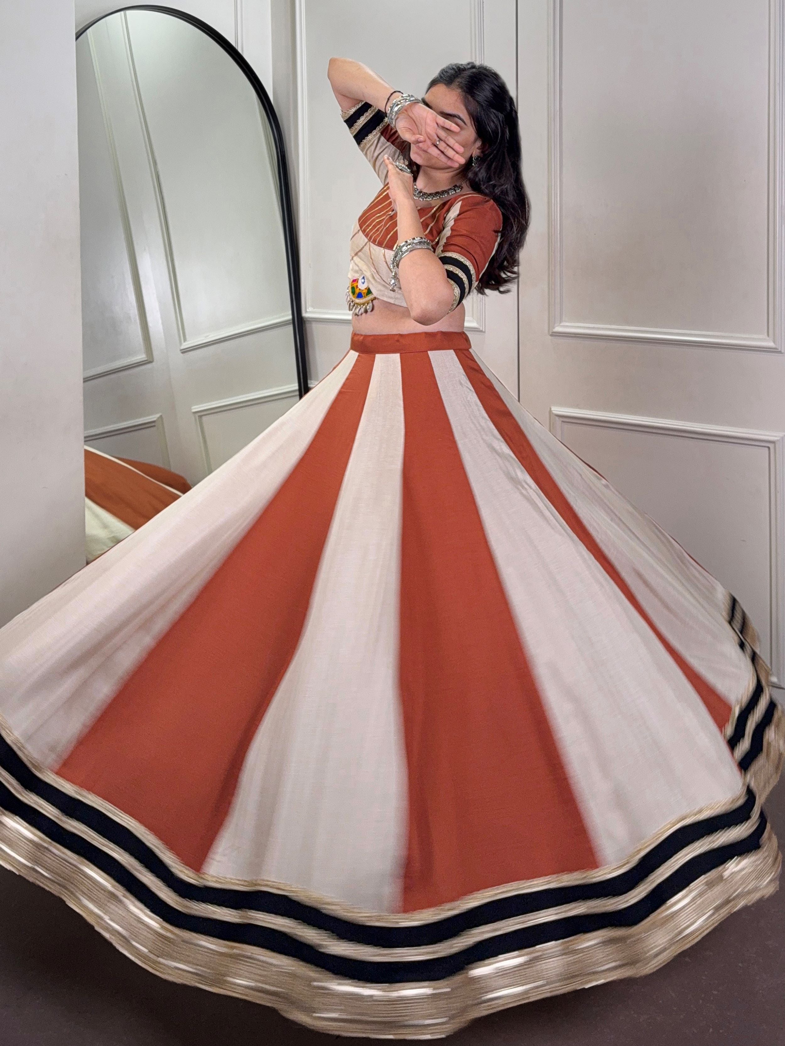 Rust orange rangoli silk lehenga choli with embroidered sequins work