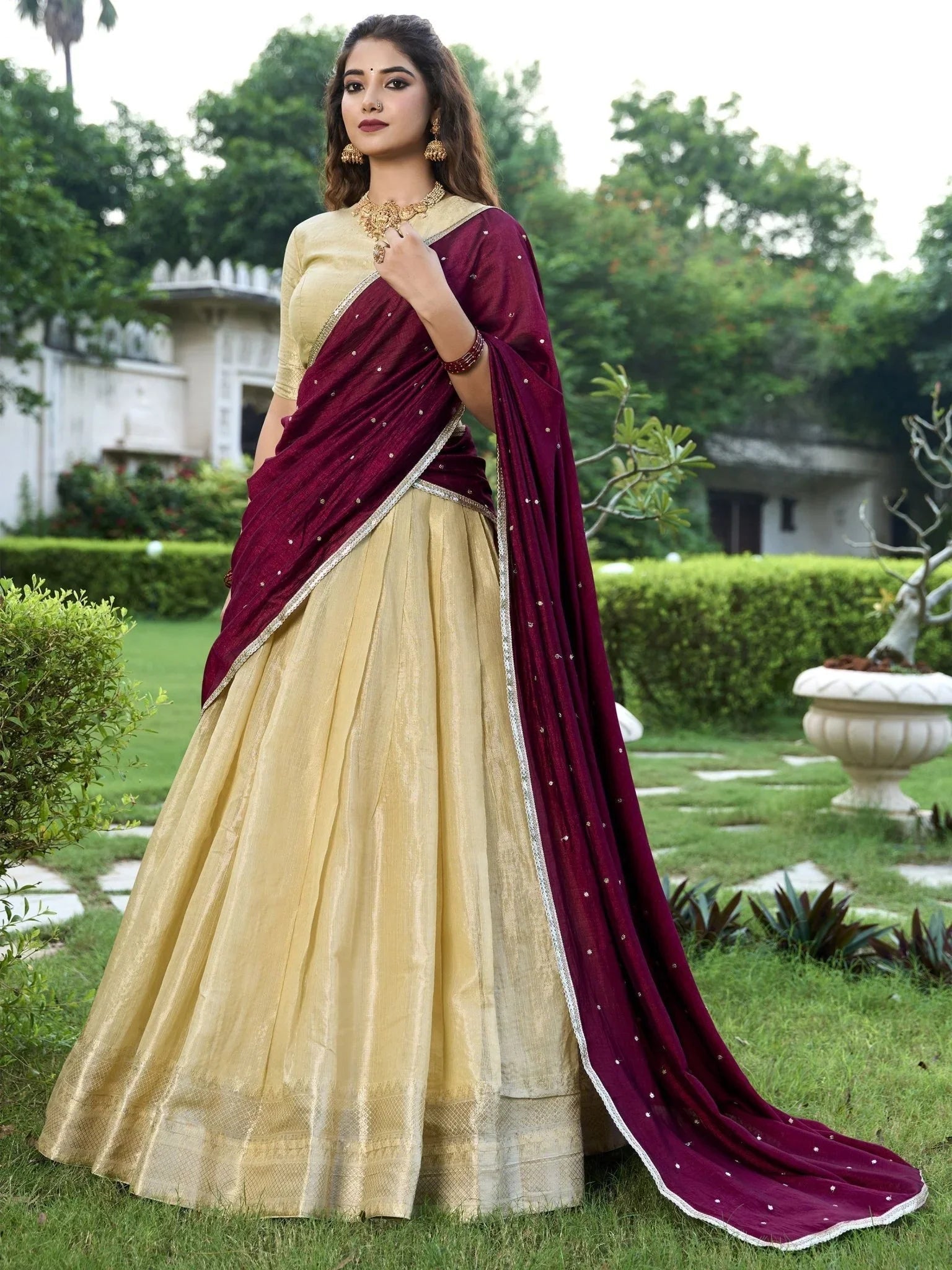 Cream kanchipuram silk lehenga choli with zari weaving and sequins embroidery