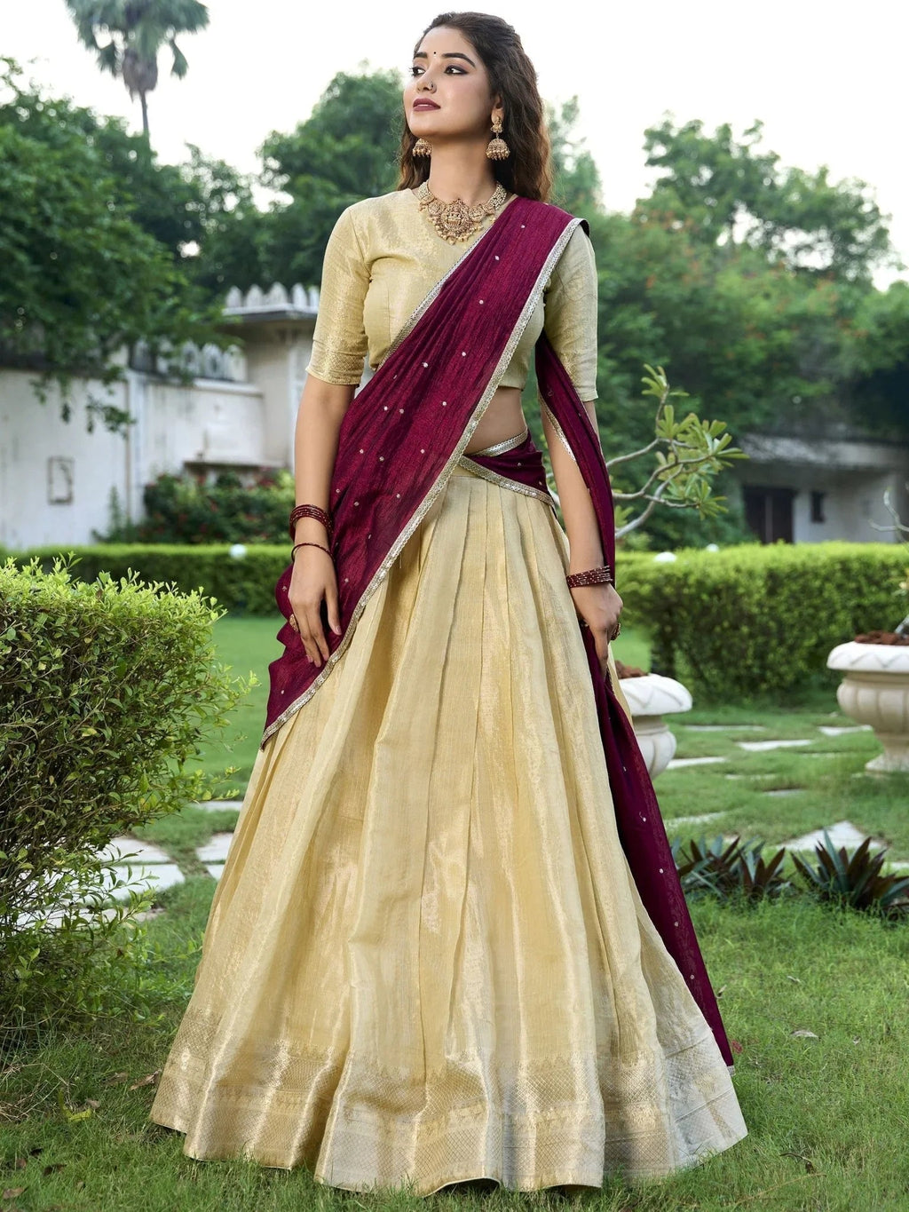 Cream kanchipuram silk lehenga choli with zari weaving and sequins embroidery